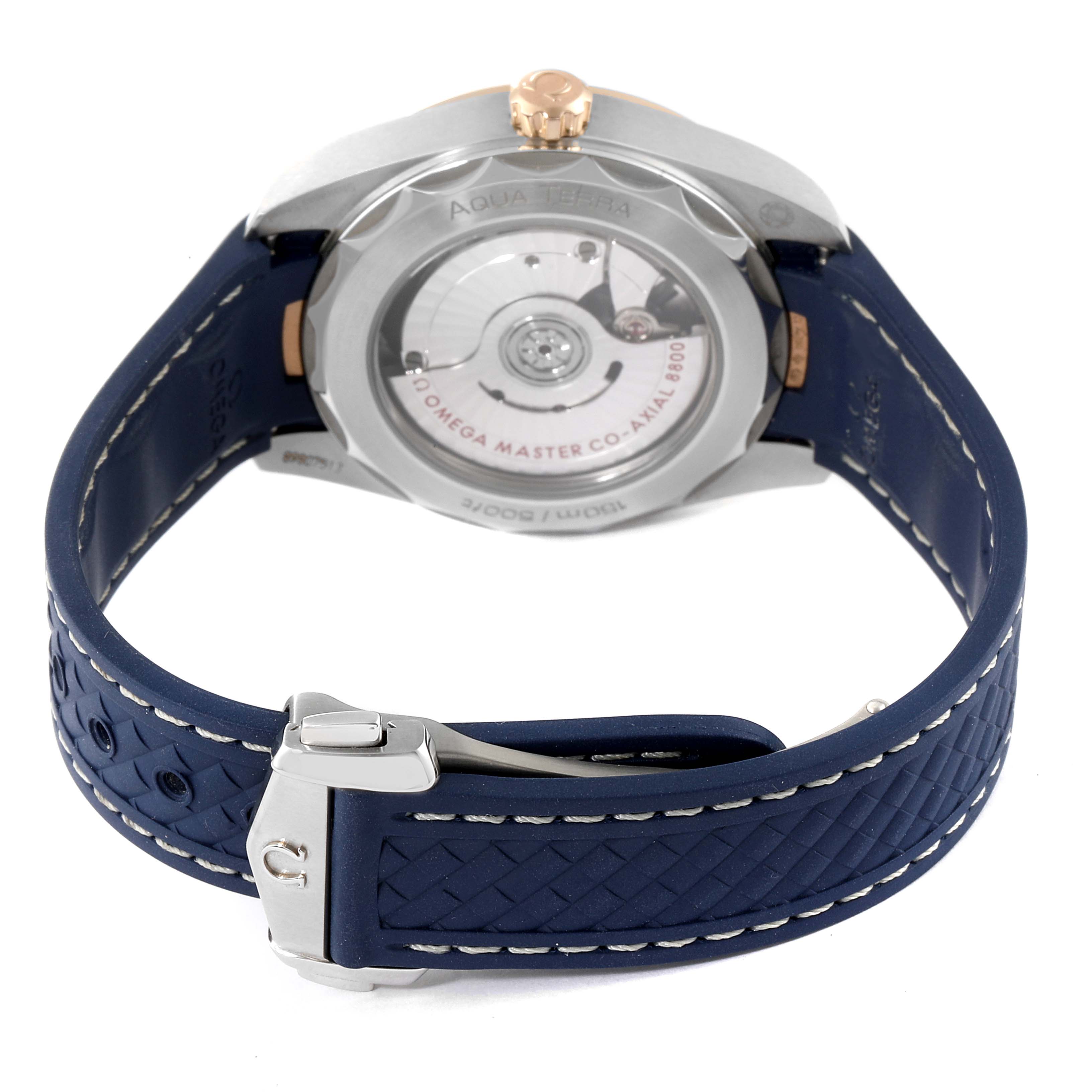 The image shows the back view of an Omega Aqua Terra 220.22.38.20.02.001 Men's Steel and Gold (two tone) Silver Dial 220.22.38.20.02.001 Men's Steel and Gold (two tone) Silver Dial watch, highlighting its case back and blue strap with a clasp.