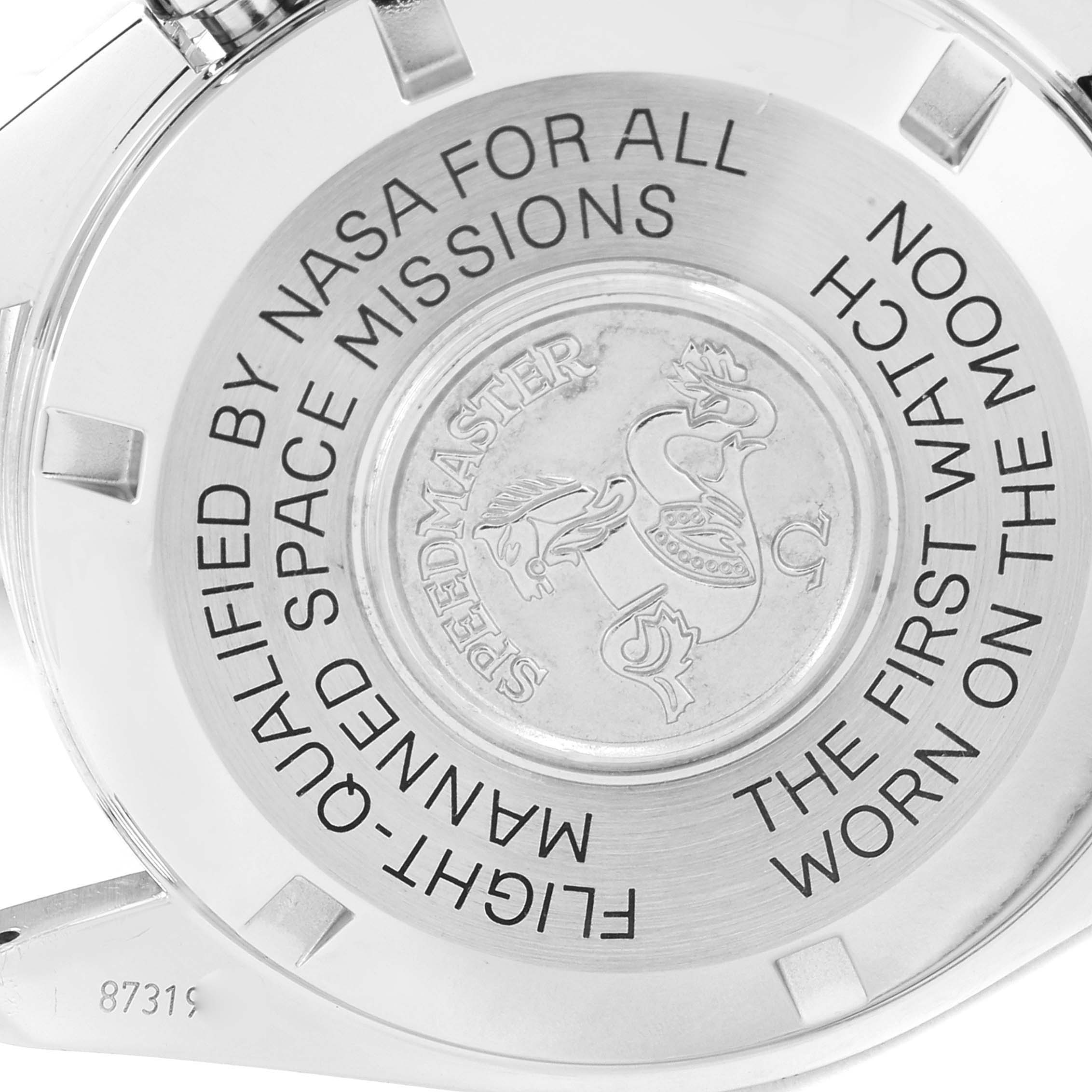 The image shows the back case of the Omega Speedmaster 311.30.42.30.01.005 Men
s Stainless Steel Black Dial 311.30.42.30.01.005 Men
s Stainless Steel Black Dial watch with engraving and a logo.