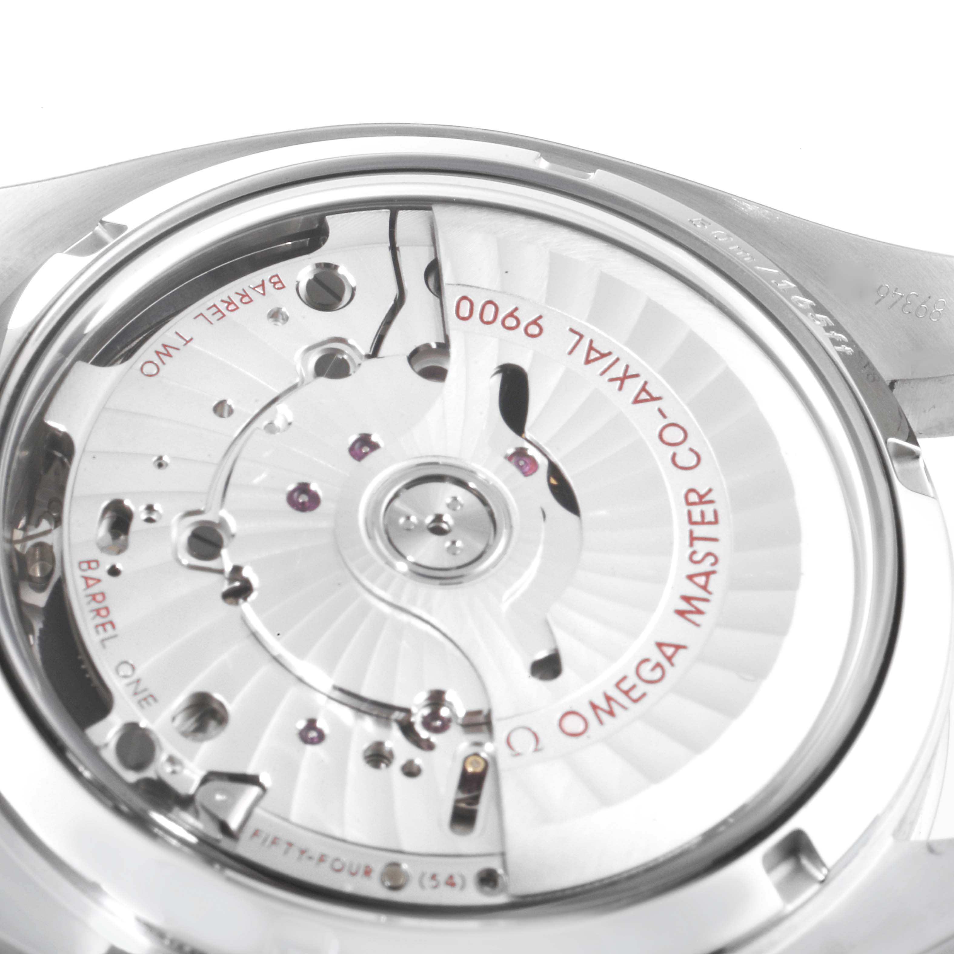 The image shows a close-up view of the movement mechanism of an Omega Speedmaster 329.30.44.51.04.001 Men's Stainless Steel White Dial 329.30.44.51.04.001 Men's Stainless Steel White Dial watch, highlighting the Omega Master Co-Axial 9900 calibers.