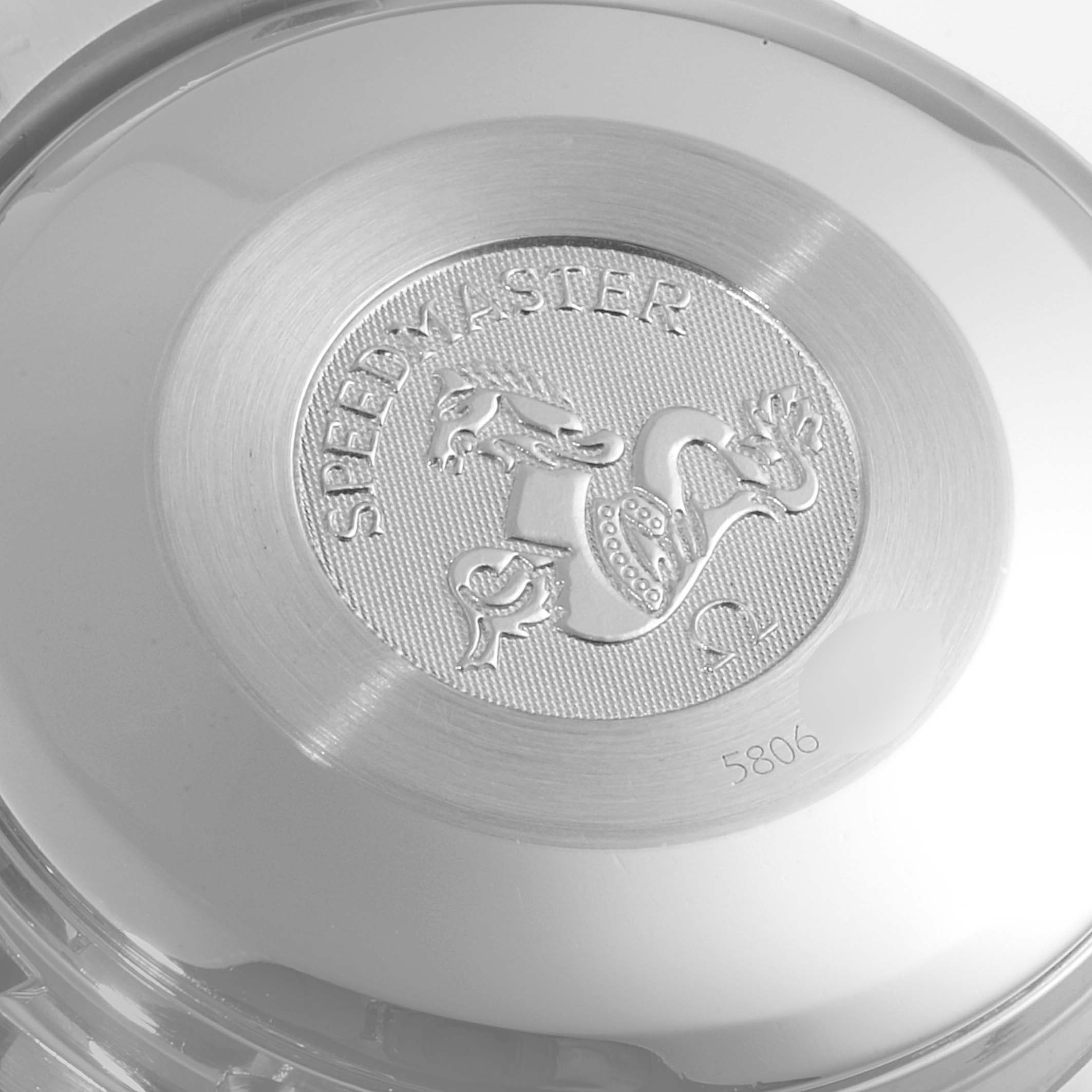 This image shows the case back of an Omega Speedmaster 3523.51.00 Men
s Stainless Steel Black Dial 3523.51.00 Men
s Stainless Steel Black Dial watch, highlighting the embossed emblem and model name.