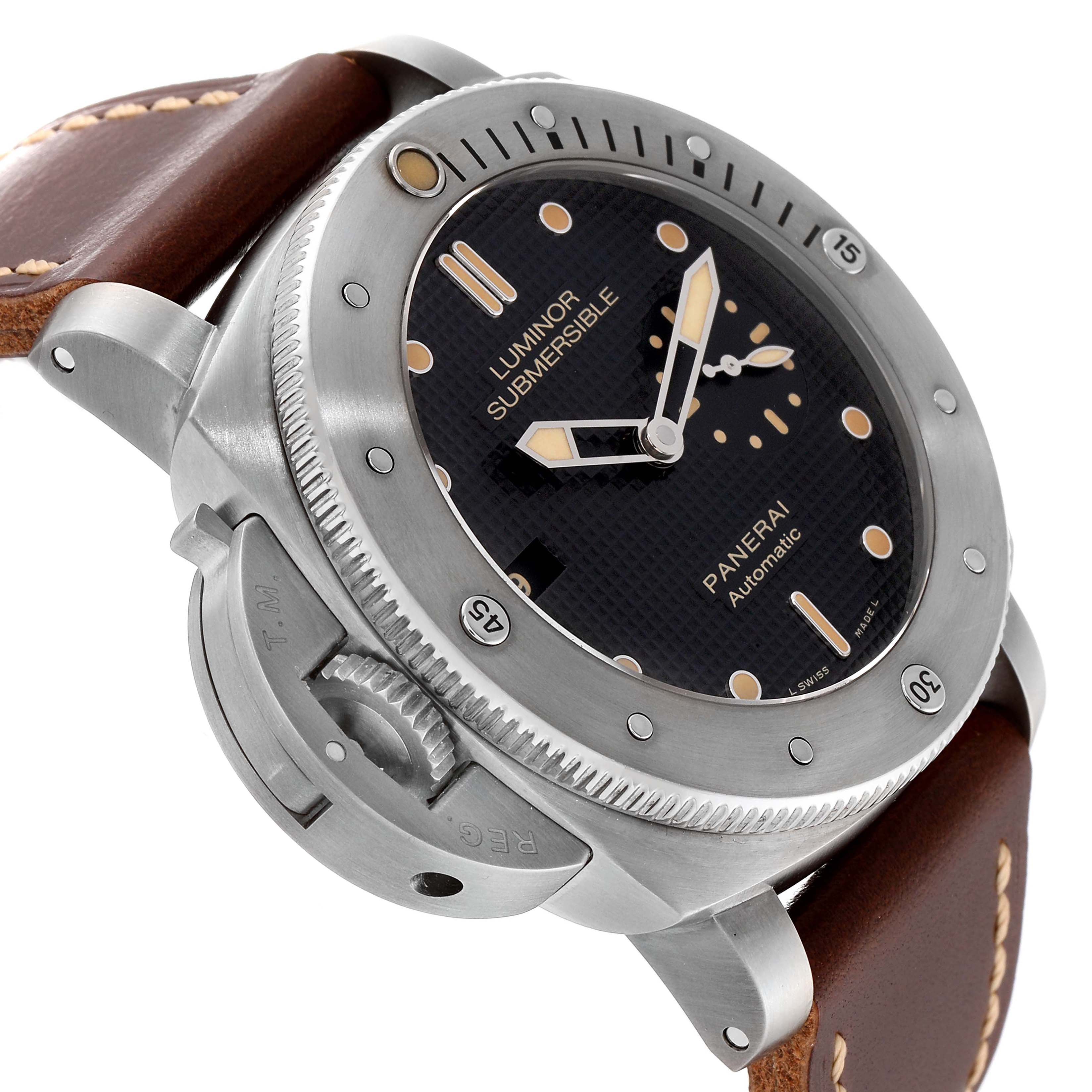 The image shows a close-up angle of a Panerai Luminor Submersible watch, showcasing the dial, bezel, crown guard, and leather strap.