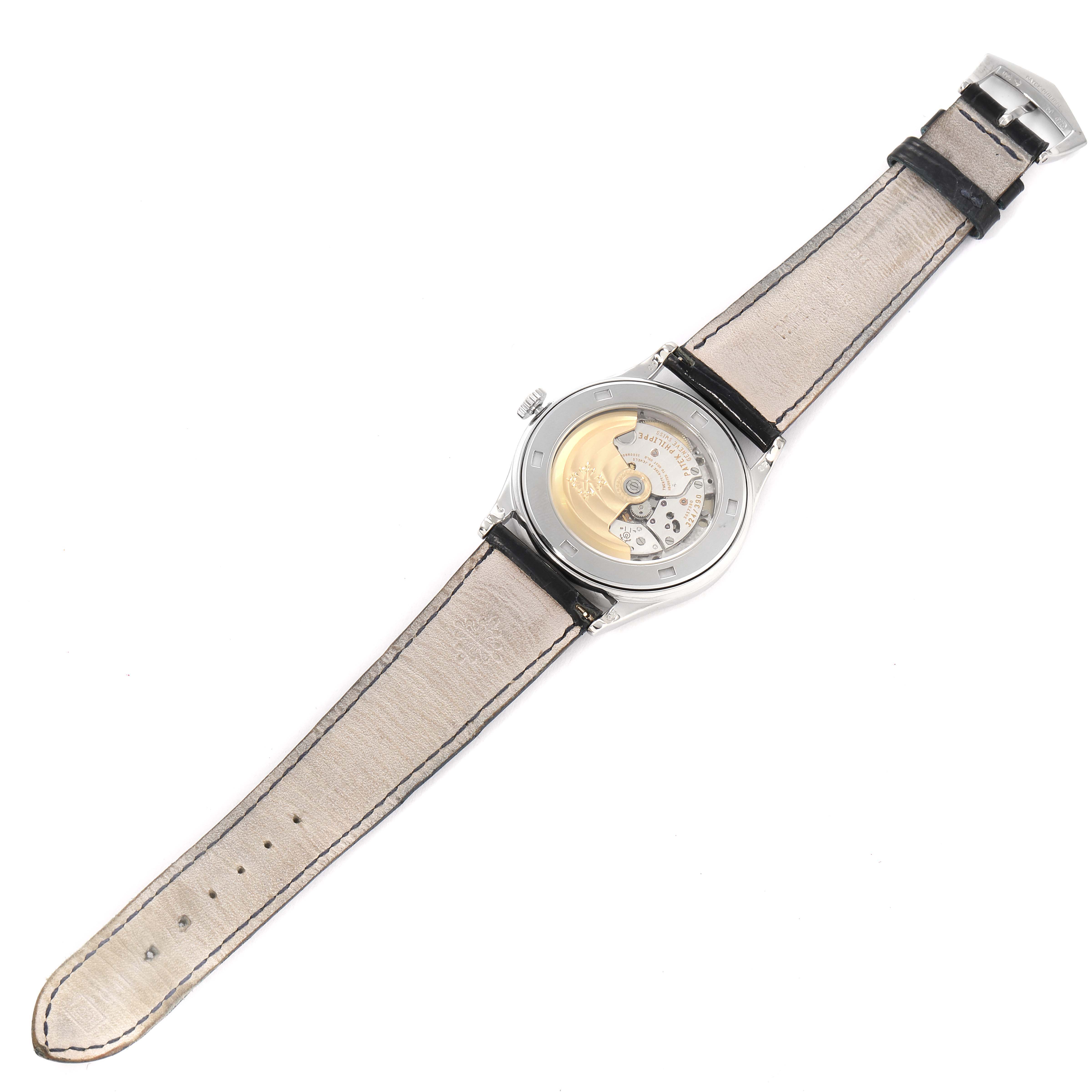 The image shows the back view of a Patek Philippe Calatrava 5296G-001 Men's White Gold Silver Dial 5296G-001 Men's White Gold Silver Dial watch, displaying the movement and leather strap.