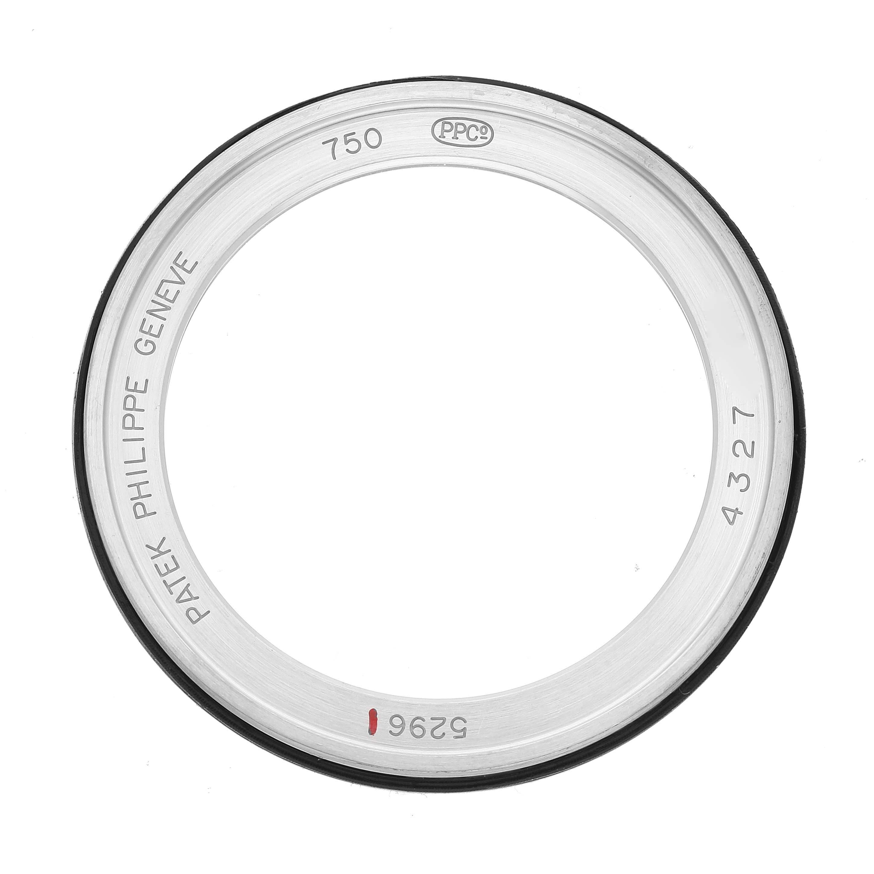 This image shows the back bezel view of a Patek Philippe Calatrava 5296G-001 Men's White Gold Silver Dial 5296G-001 Men's White Gold Silver Dial watch, featuring engravings of the brand and model details.