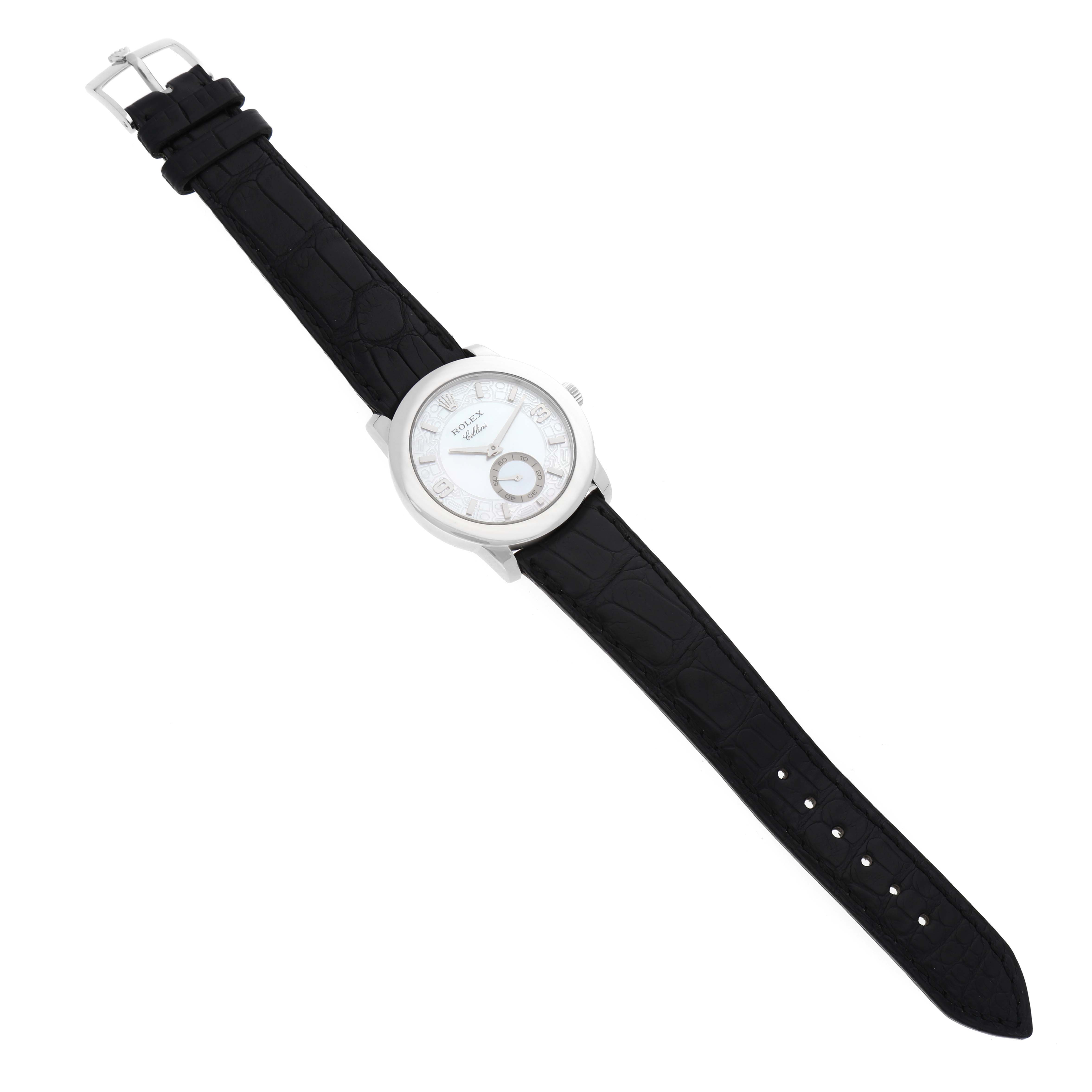 The Rolex Cellini 5240/6 Men's Platinum Mother of Pearl Dial 5240/6 Men's Platinum Mother of Pearl Dial watch is shown laid flat from an overhead view, displaying its face, black leather strap, and clasp.