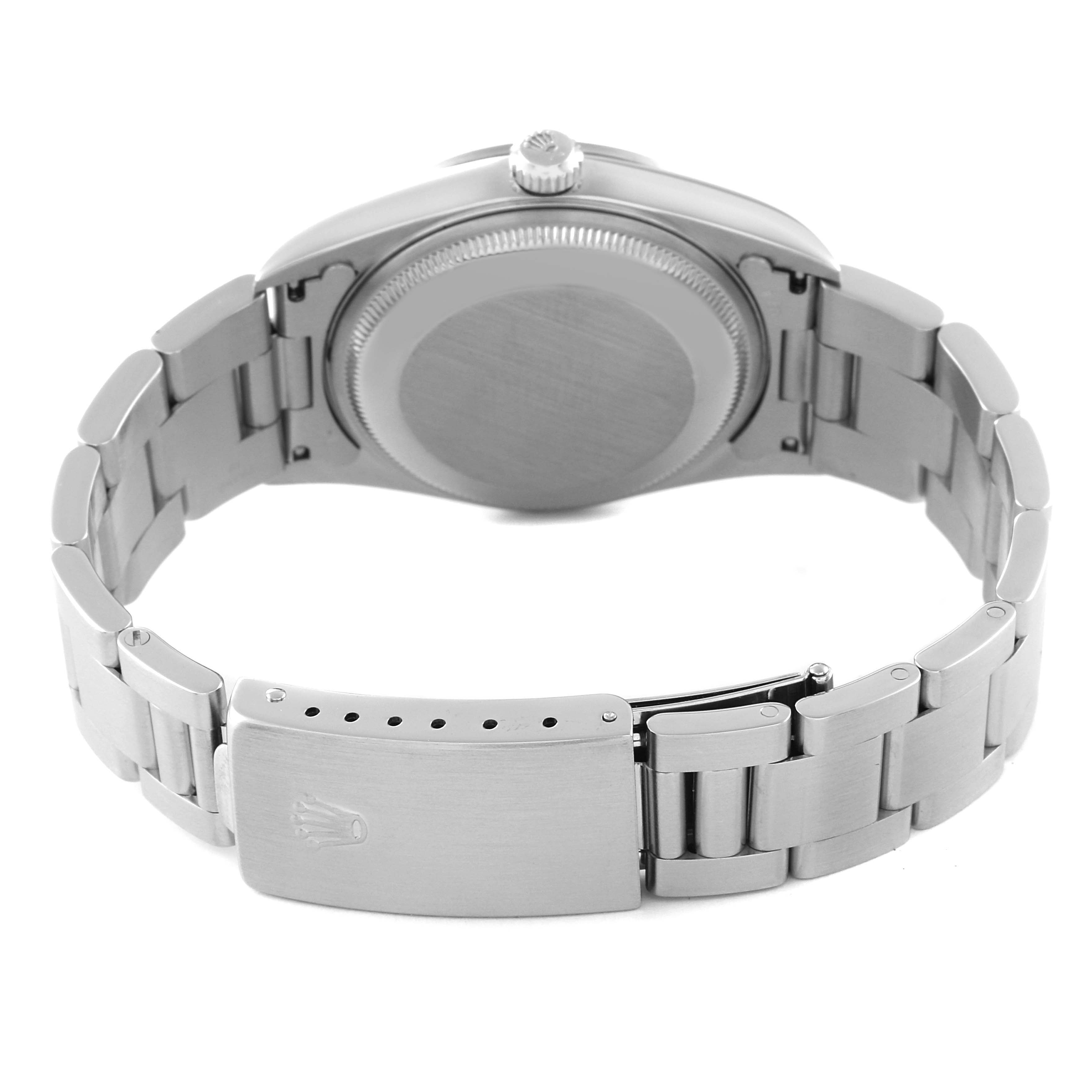 The image shows the back view of a Rolex Date 15200 Men's Stainless Steel Pink Dial 15200 Men's Stainless Steel Pink Dial model watch, highlighting the case back, crown, and metal bracelet with the clasp.