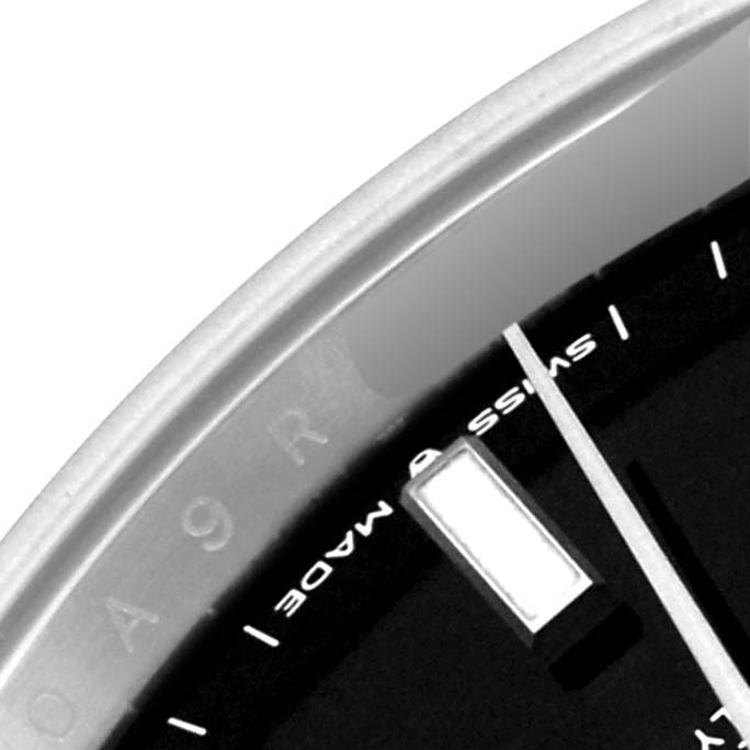 This close-up image shows part of the dial, bezel, and index of a Rolex Datejust 41 126300 Men
s Stainless Steel Black Dial 126300 Men
s Stainless Steel Black Dial watch.