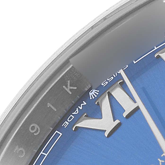 This image shows a close-up of the dial edge of a Rolex Datejust 41 126300 Men's Stainless Steel Blue Dial 126300 Men's Stainless Steel Blue Dial watch, focusing on the "Swiss Made" marking and part of the Roman numeral.