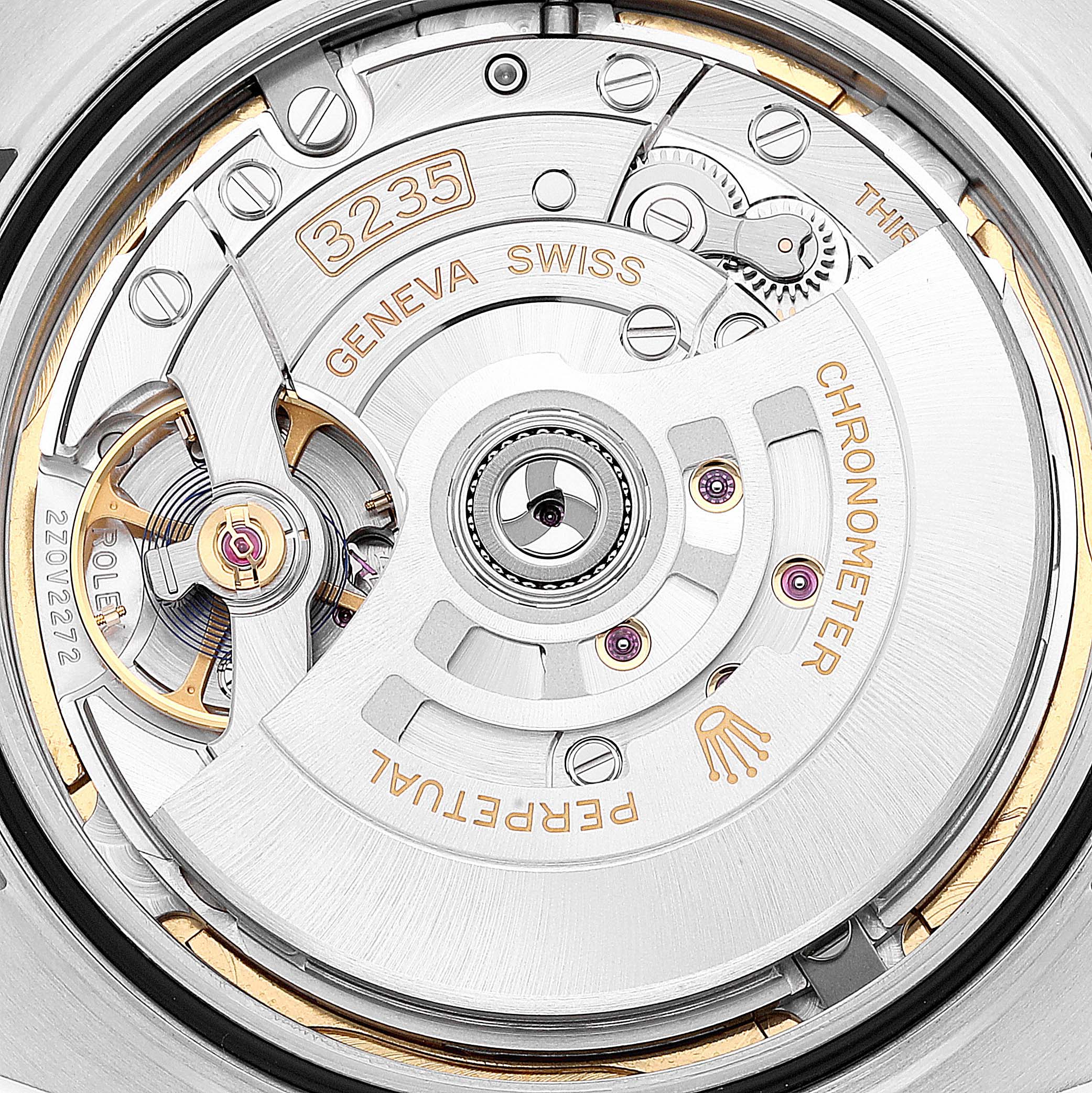 This close-up image shows the intricate mechanism inside a Rolex Datejust 41 126300 Men's Stainless Steel Blue Dial 126300 Men's Stainless Steel Blue Dial watch, focusing on the movement labeled 3235.