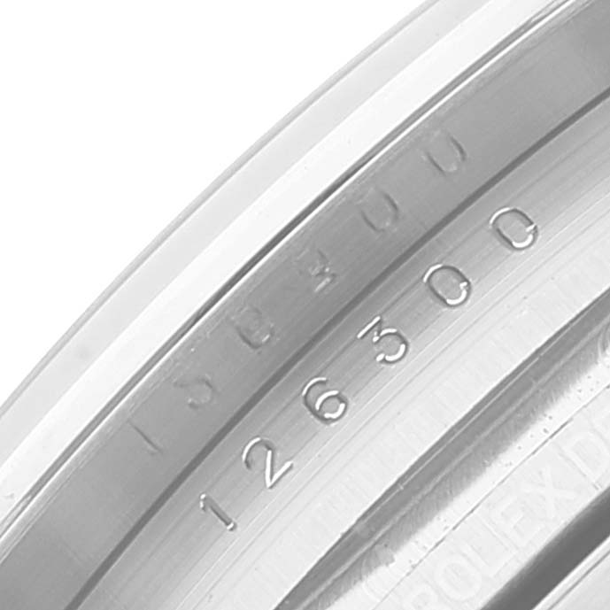 This image shows a close-up of the inner bezel and case serial number of the Rolex Datejust 41 126300 Men's Stainless Steel Blue Dial 126300 Men's Stainless Steel Blue Dial watch.
