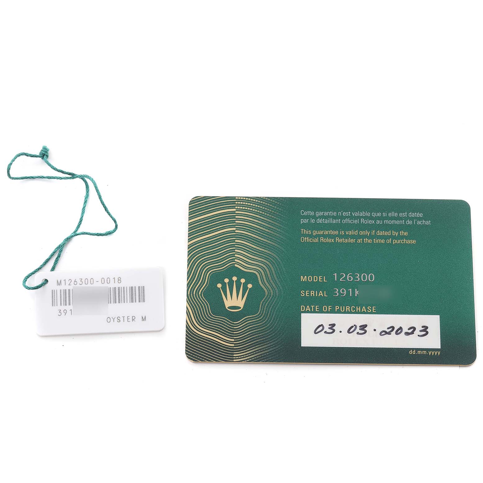 The image shows a warranty card and a tag for the Rolex Datejust 41 126300 Men's Stainless Steel Blue Dial 126300 Men's Stainless Steel Blue Dial model.