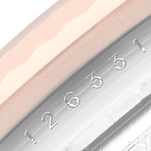 This image shows a close-up of the Rolex Datejust 41 126331 Men's Steel and Gold (two tone) Mother of Pearl Dial 126331 Men's Steel and Gold (two tone) Mother of Pearl Dial bezel and date display.