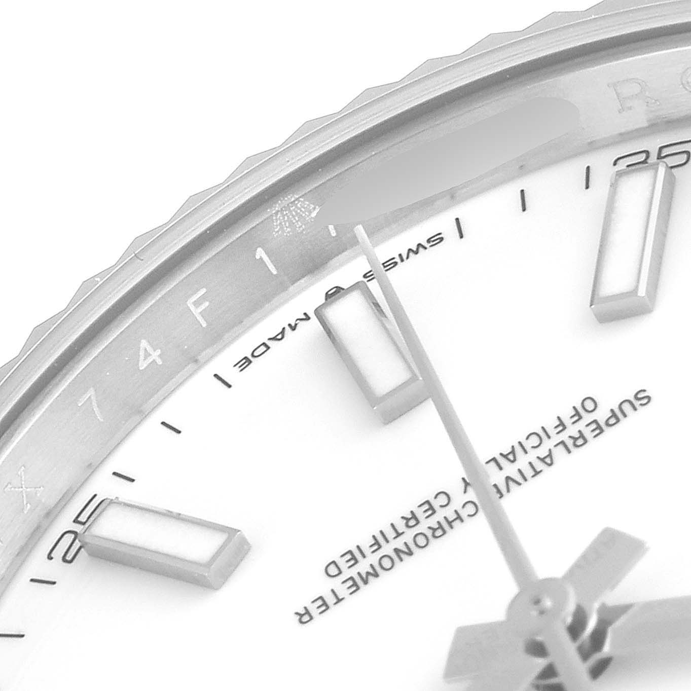 This image shows a close-up of the dial and part of the bezel of a Rolex Datejust 41 126334 Men's Stainless Steel White Dial 126334 Men's Stainless Steel White Dial watch.