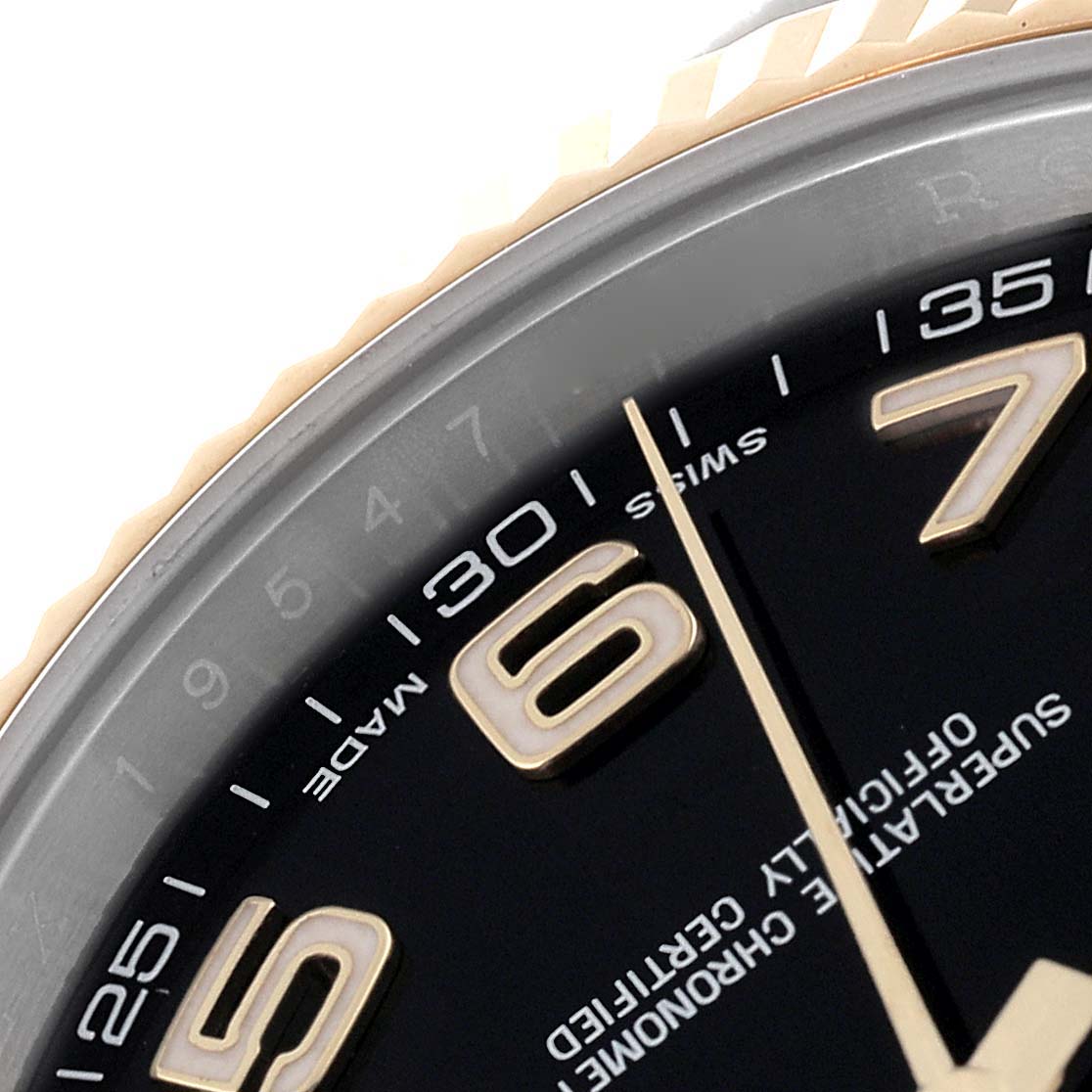 The image shows a close-up view of the dial, numbers, and part of the bezel of the Rolex Datejust 41 126333 Men's Steel and Gold (two tone) Black Dial 126333 Men's Steel and Gold (two tone) Black Dial watch.