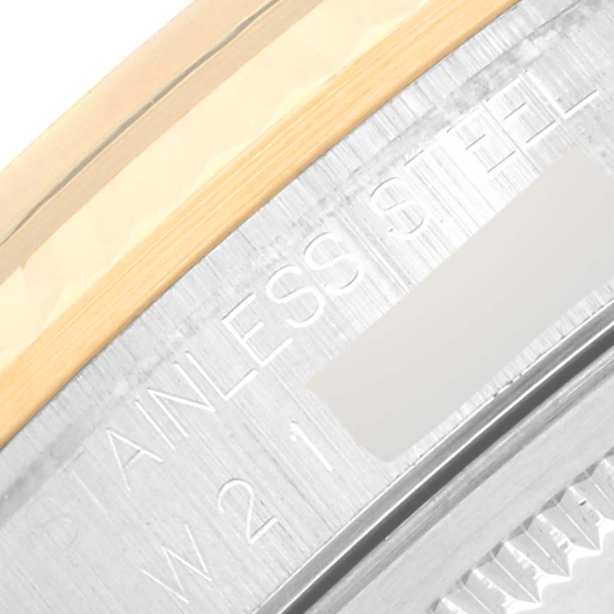 This image shows a close-up of the side of a Rolex Datejust 16233 Men's Steel and Gold (two tone) Blue Dial 16233 Men's Steel and Gold (two tone) Blue Dial watch, highlighting the stainless steel text and part of the bezel.