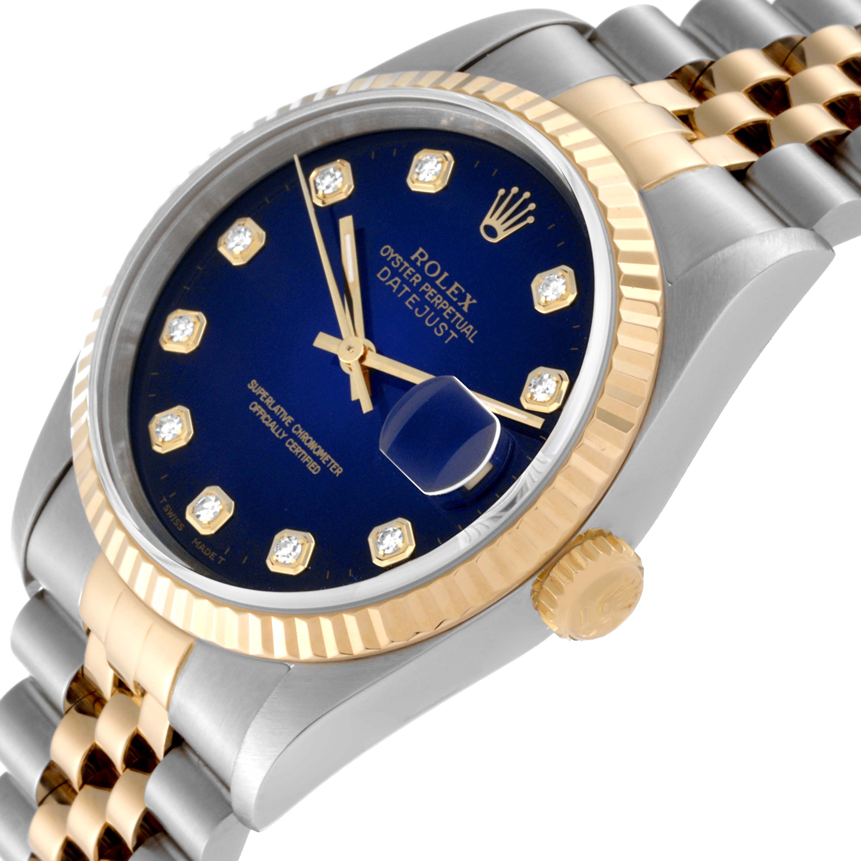 This Rolex Datejust 16233 Men's Steel and Gold (two tone) Blue Dial 16233 Men's Steel and Gold (two tone) Blue Dial watch is shown at an angled side view, highlighting its blue dial, gold bezel, and two-tone bracelet.