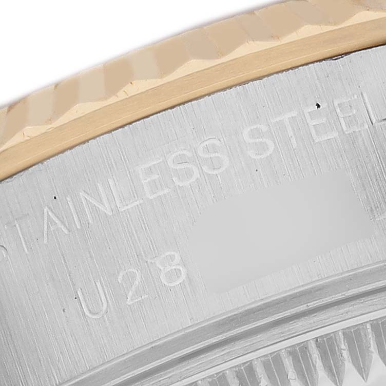 This image shows a close-up view of the case back and bezel of a Rolex Datejust 69173 Women's Steel and Gold (two tone) Grey Dial 69173 Women's Steel and Gold (two tone) Grey Dial watch, highlighting the "Stainless Steel" engraving.