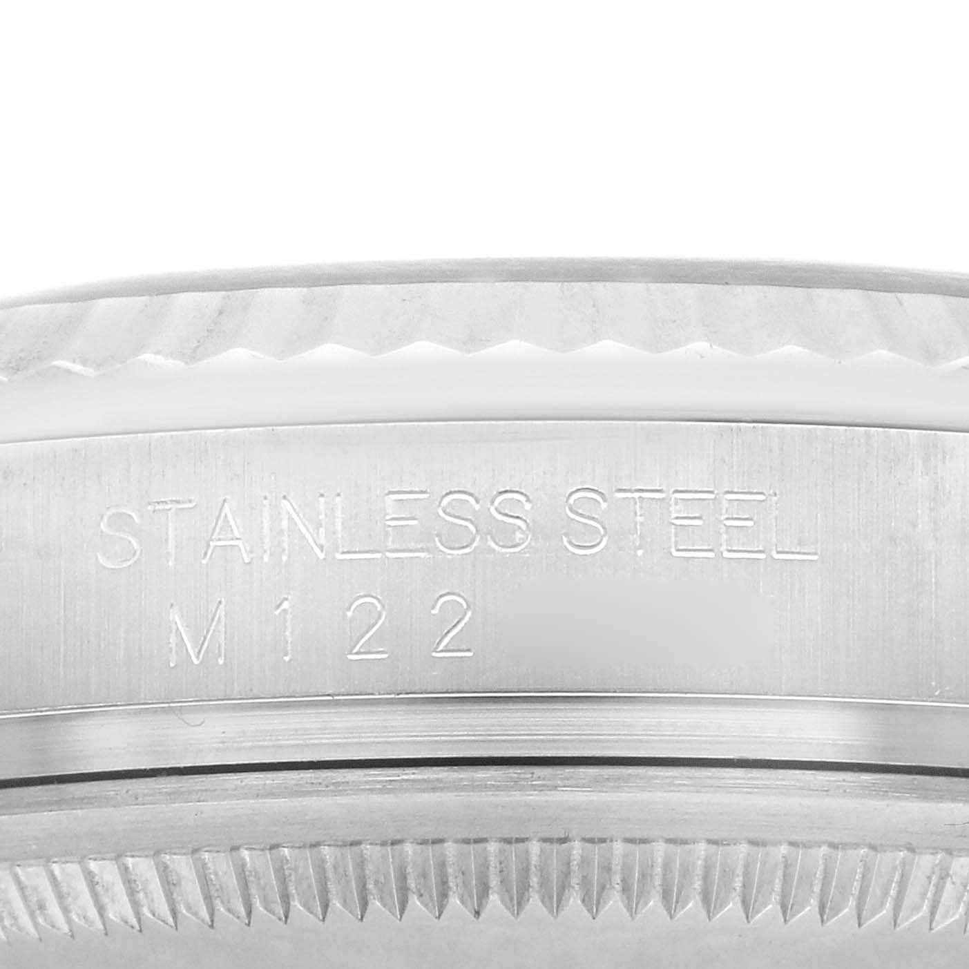 This image shows a close-up of the stainless steel casing's edge and bezel of a Rolex Datejust 116234 Men's Stainless Steel Black Dial 116234 Men's Stainless Steel Black Dial model watch.