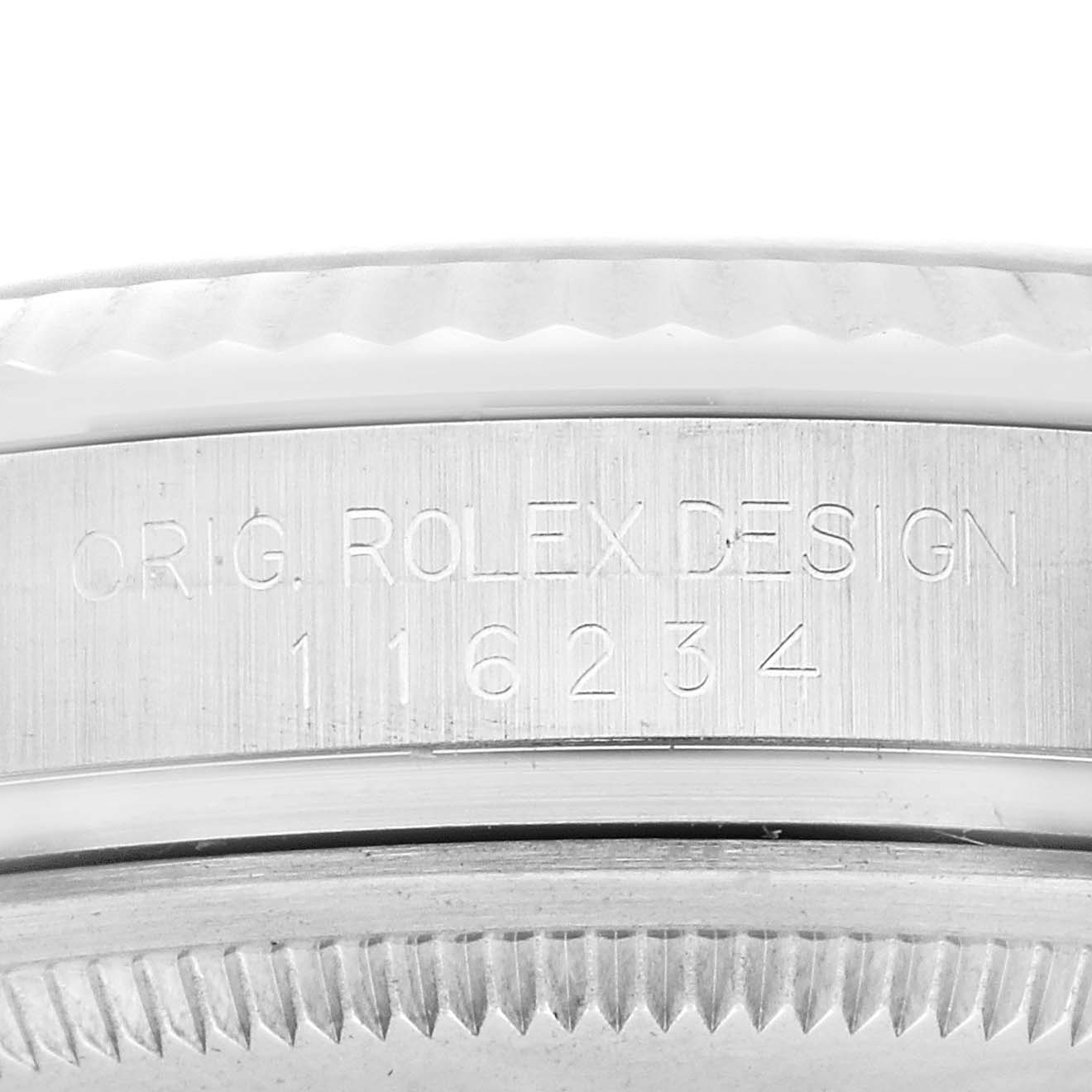 This image shows a close-up of the side of a Rolex Datejust 116234 Men's Stainless Steel Black Dial 116234 Men's Stainless Steel Black Dial watch, featuring the engraved text "ORIG. ROLEX DESIGN" and the model number "116234".