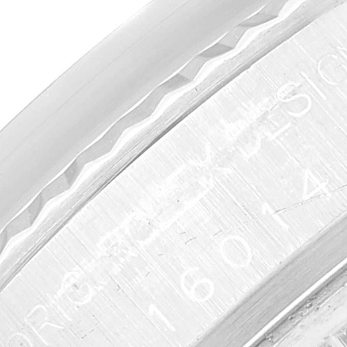 This is a close-up shot of the bezel and case of a Rolex Vintage Collection 16014 Men's Stainless Steel Silver Dial 16014 Men's Stainless Steel Silver Dial model.