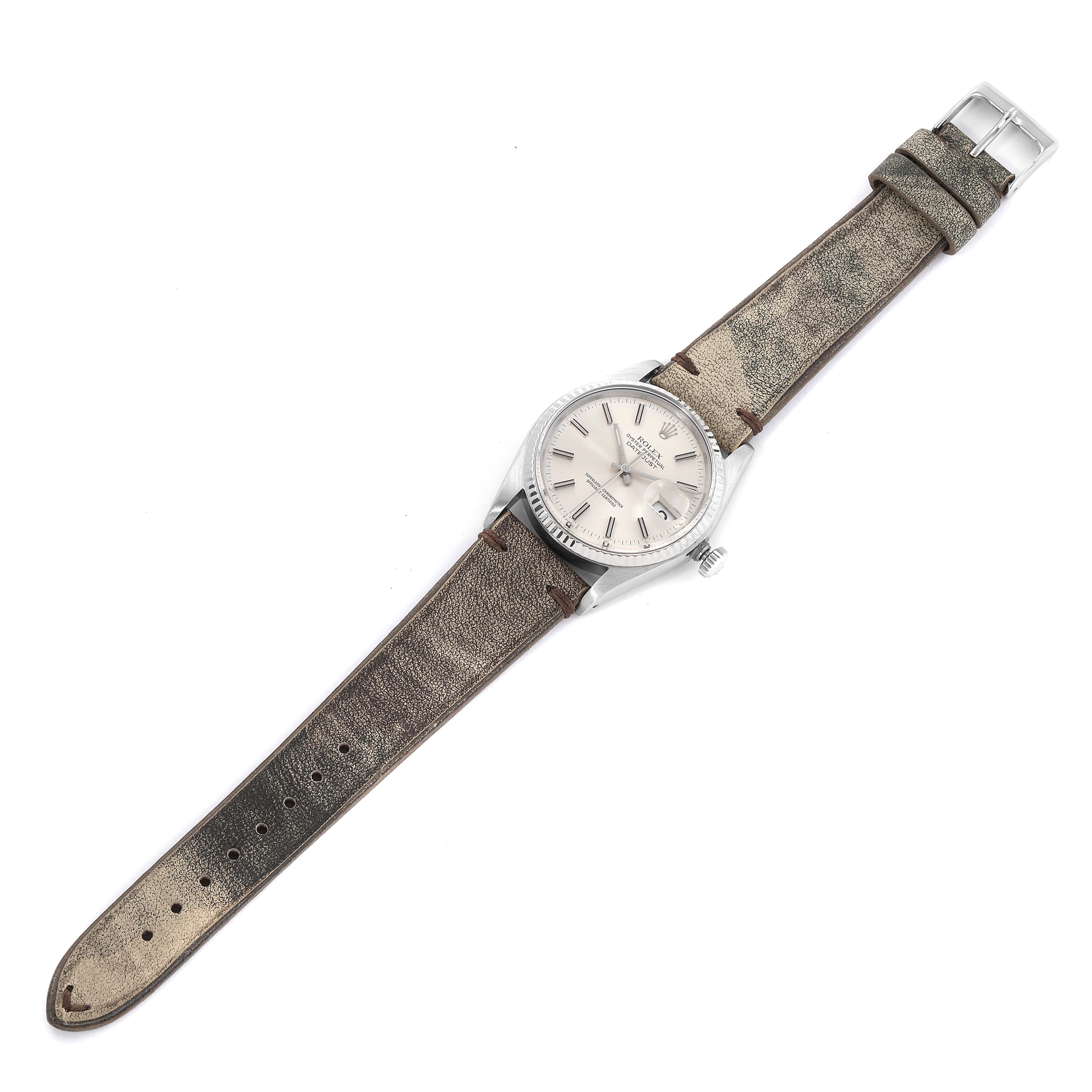 This image shows a top view of the Rolex Vintage Collection 16014 Men's Stainless Steel Silver Dial 16014 Men's Stainless Steel Silver Dial watch, displaying the face, bezel, and full leather strap.