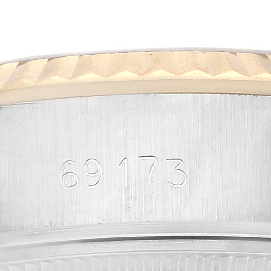 The image shows a close-up view of the Rolex Datejust 69173G Women's Steel and Gold (two tone) White Dial 69173G Women's Steel and Gold (two tone) White Dial 69173 model with part of the bezel and the case back visible.