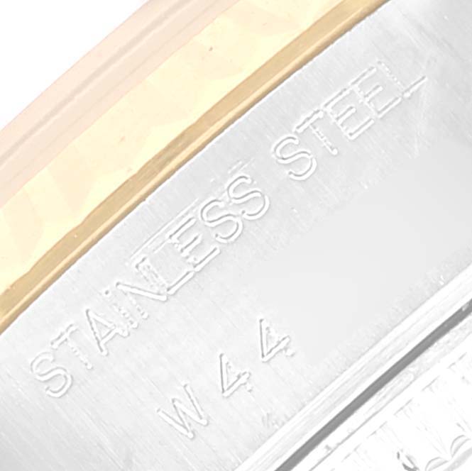 This close-up image shows a part of the stainless steel case of a Rolex Datejust 69173 Women's Steel and Gold (two tone) Champagne Dial 69173 Women's Steel and Gold (two tone) Champagne Dial watch.