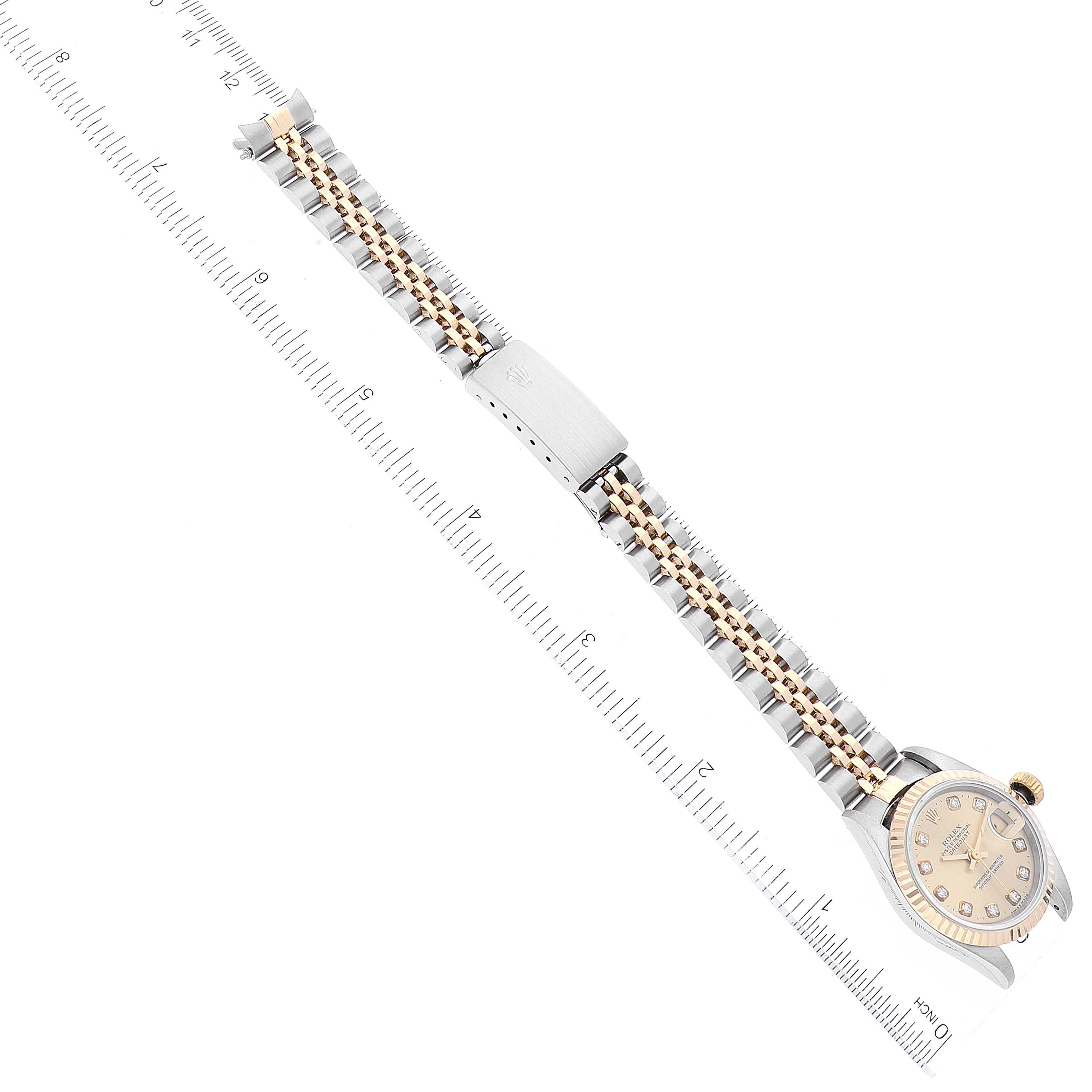 The image shows the Rolex Datejust 69173 Women's Steel and Gold (two tone) Champagne Dial 69173 Women's Steel and Gold (two tone) Champagne Dial watch from a top-down angle, highlighting its bracelet and face.