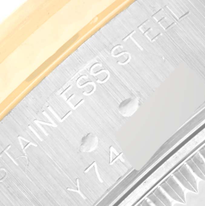 This close-up image shows the stainless steel case back and partial bezel of a Rolex Datejust 79173 Women's Stainless Steel Mother of Pearl Dial 79173 Women's Stainless Steel Mother of Pearl Dial watch.