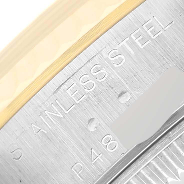 This image shows a close-up of the stainless steel case side of a Rolex Datejust 79173 Women's Steel and Gold (two tone) White Dial 79173 Women's Steel and Gold (two tone) White Dial watch.