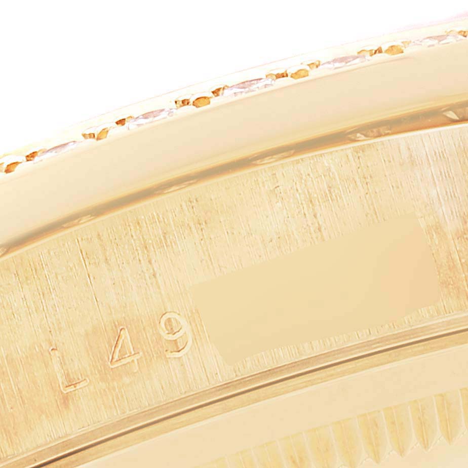 Close-up of the edge and engravings on the bezel of a Rolex President 18348 Men
s Yellow Gold Champagne Dial 18348 Men
s Yellow Gold Champagne Dial model watch.