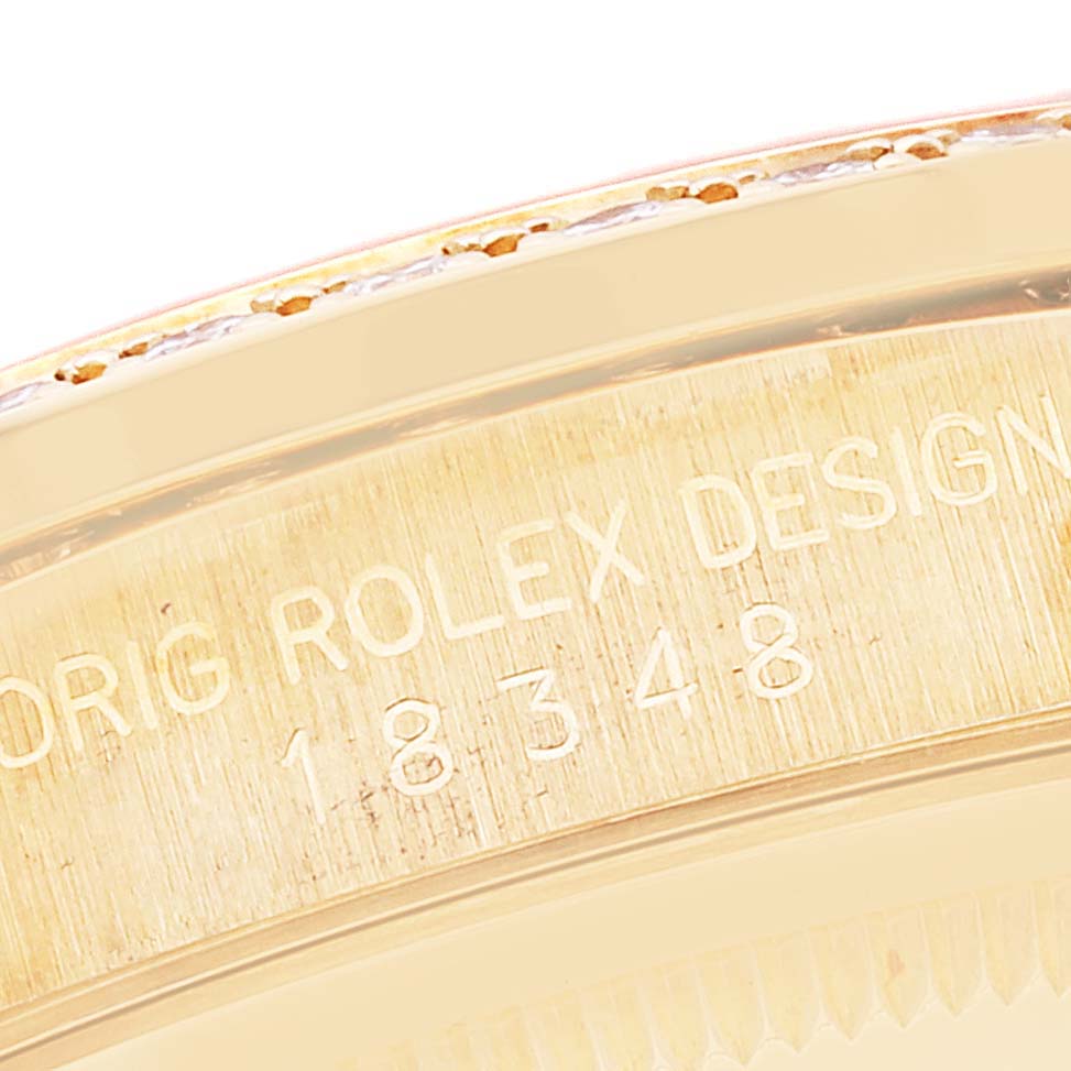 The image shows a close-up of the serial number engraving on the case of a Rolex President 18348 Men
s Yellow Gold Champagne Dial 18348 Men
s Yellow Gold Champagne Dial model watch.