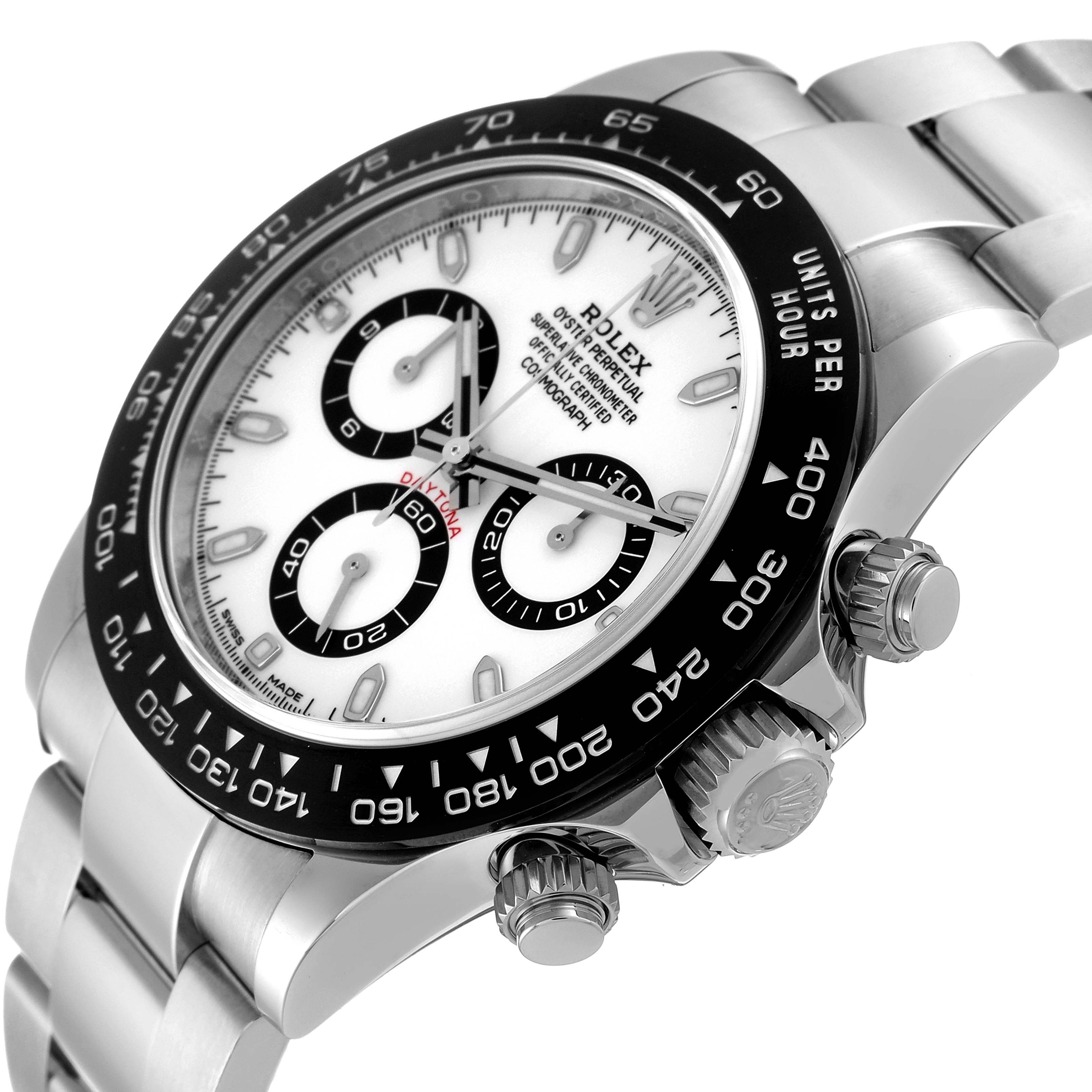 The image shows a Rolex Daytona 116500 Men
s Stainless Steel White Dial 116500 Men
s Stainless Steel White Dial watch at an angled close-up, focusing on the dial, bezel, and crown.