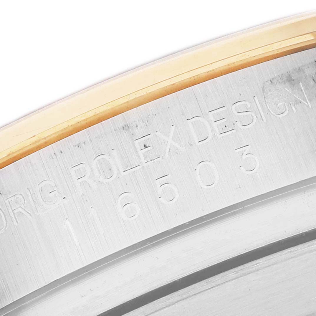 This image shows a close-up of the engraved inner bezel and model number of a Rolex Daytona 116503 Men
s Steel and Gold (two tone) Mother of Pearl Dial 116503 Men
s Steel and Gold (two tone) Mother of Pearl Dial watch.