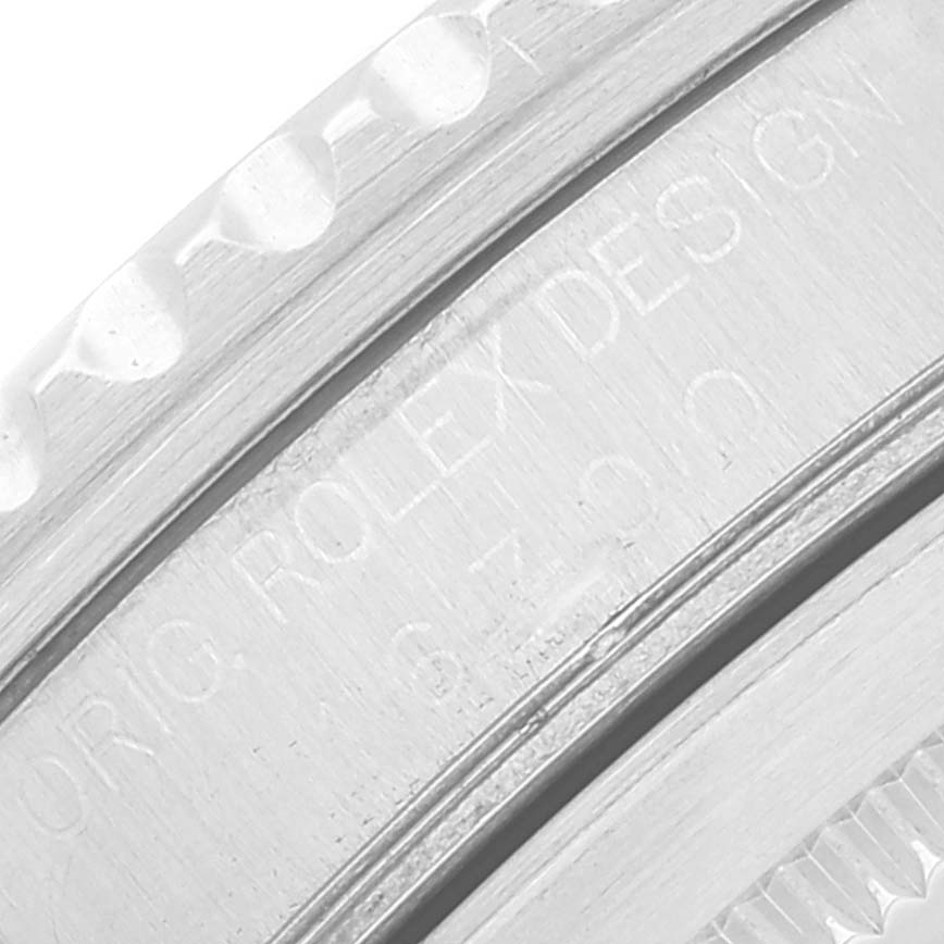 The image shows a close-up of the engraved case side of a Rolex GMT-Master 16700 Men's Stainless Steel Black Dial 16700 Men's Stainless Steel Black Dial watch.