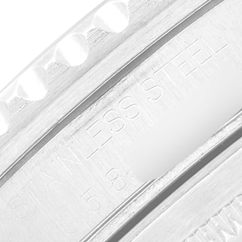 This close-up image shows the stainless steel case and bezel engraving of a Rolex GMT-Master 16700 Men's Stainless Steel Black Dial 16700 Men's Stainless Steel Black Dial watch.