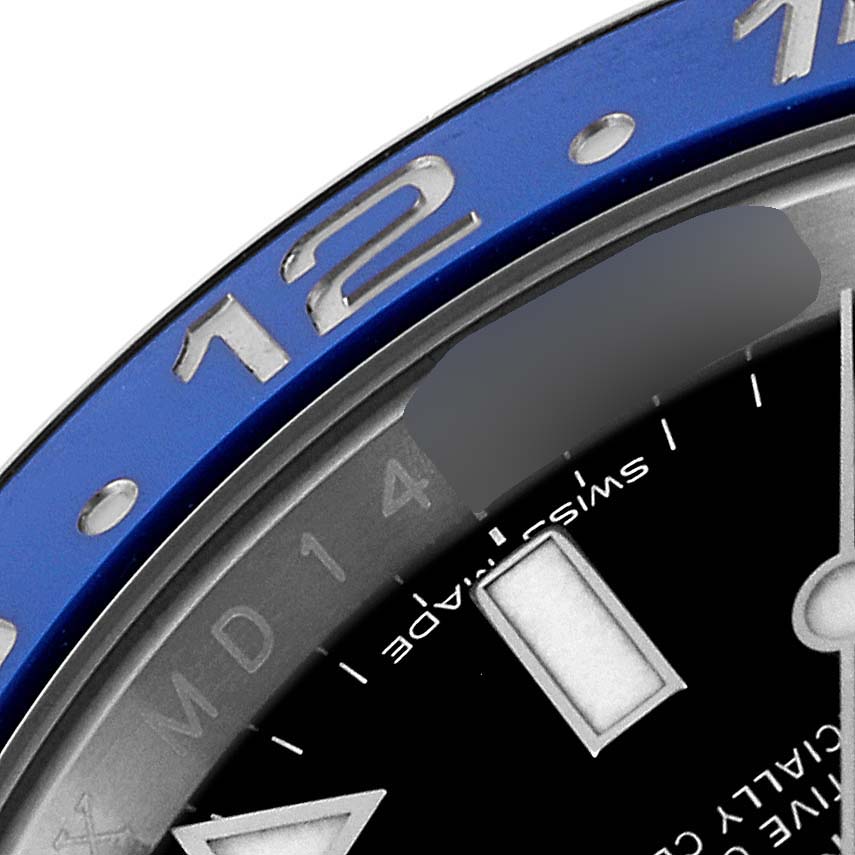 This close-up image of a Rolex GMT-Master 116710 Men's Stainless Steel Black Dial 116710 Men's Stainless Steel Black Dial watch shows part of the bezel, dial, and hour marker from an oblique angle.