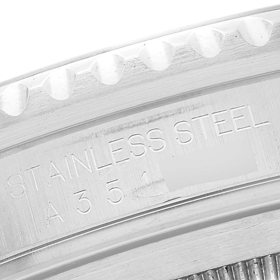 This image shows a close-up of the case back edge of a Rolex GMT-Master 16710 Men
s Stainless Steel Black Dial 16710 Men
s Stainless Steel Black Dial, highlighting its "Stainless Steel" engraving.
