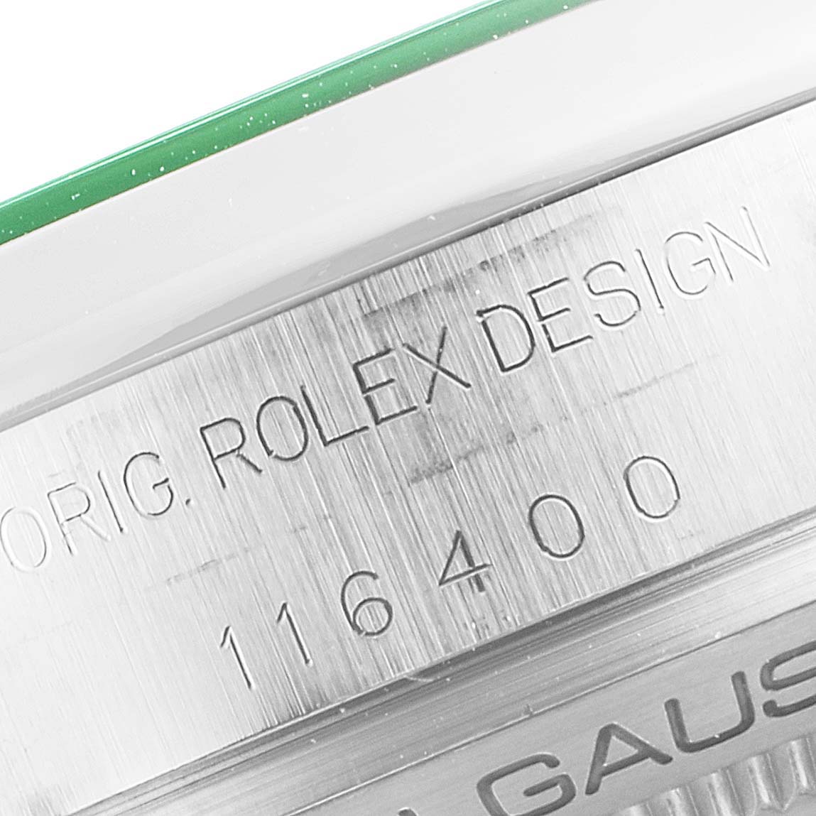 This close-up image shows the engraved detail on the bezel and side of a Rolex Milgauss 116400V Men's Stainless Steel Black Dial 116400V Men's Stainless Steel Black Dial watch.