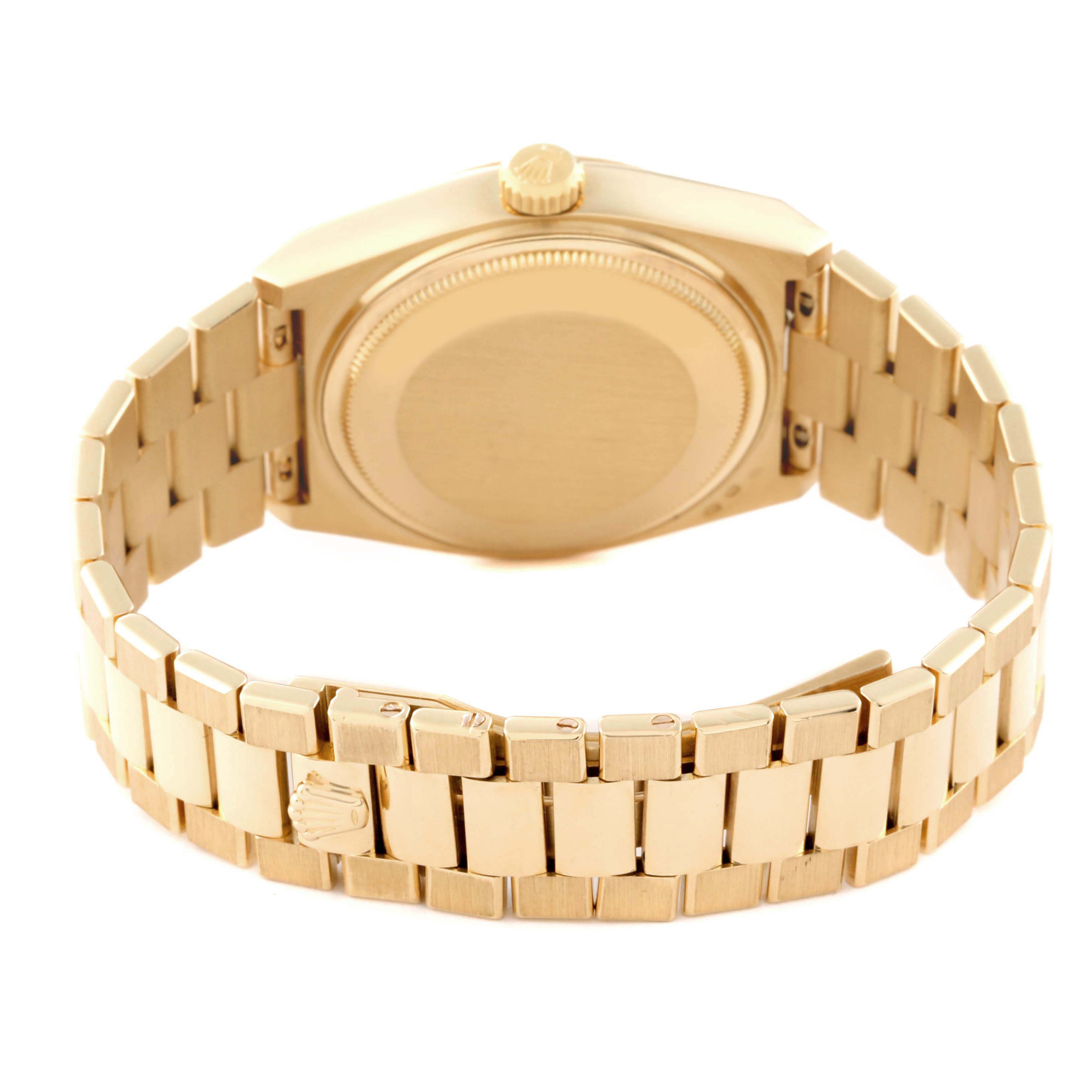 The image shows the back view of a Rolex Oysterquartz 19018 Men's Yellow Gold Champagne Dial 19018 Men's Yellow Gold Champagne Dial watch, including the case and bracelet.