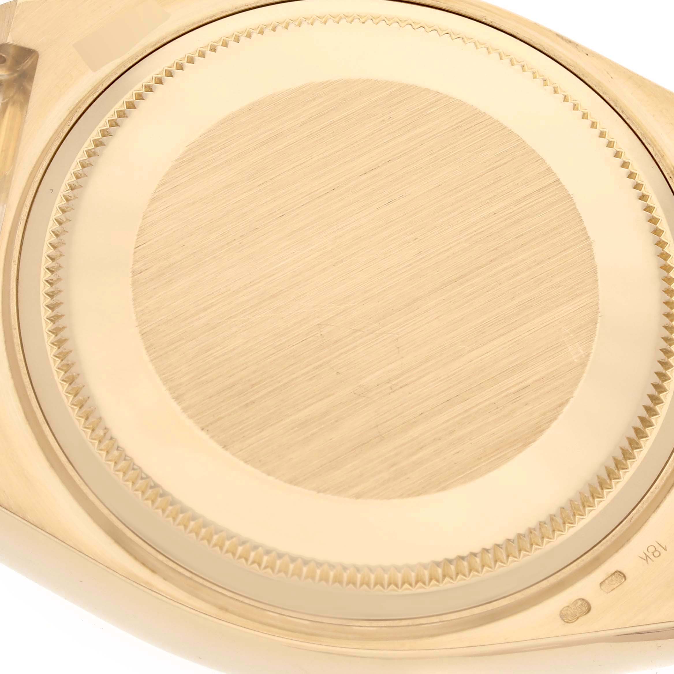 This is the case back of a Rolex Oysterquartz 19018 Men's Yellow Gold Champagne Dial 19018 Men's Yellow Gold Champagne Dial watch, shown from a bottom-up angle.