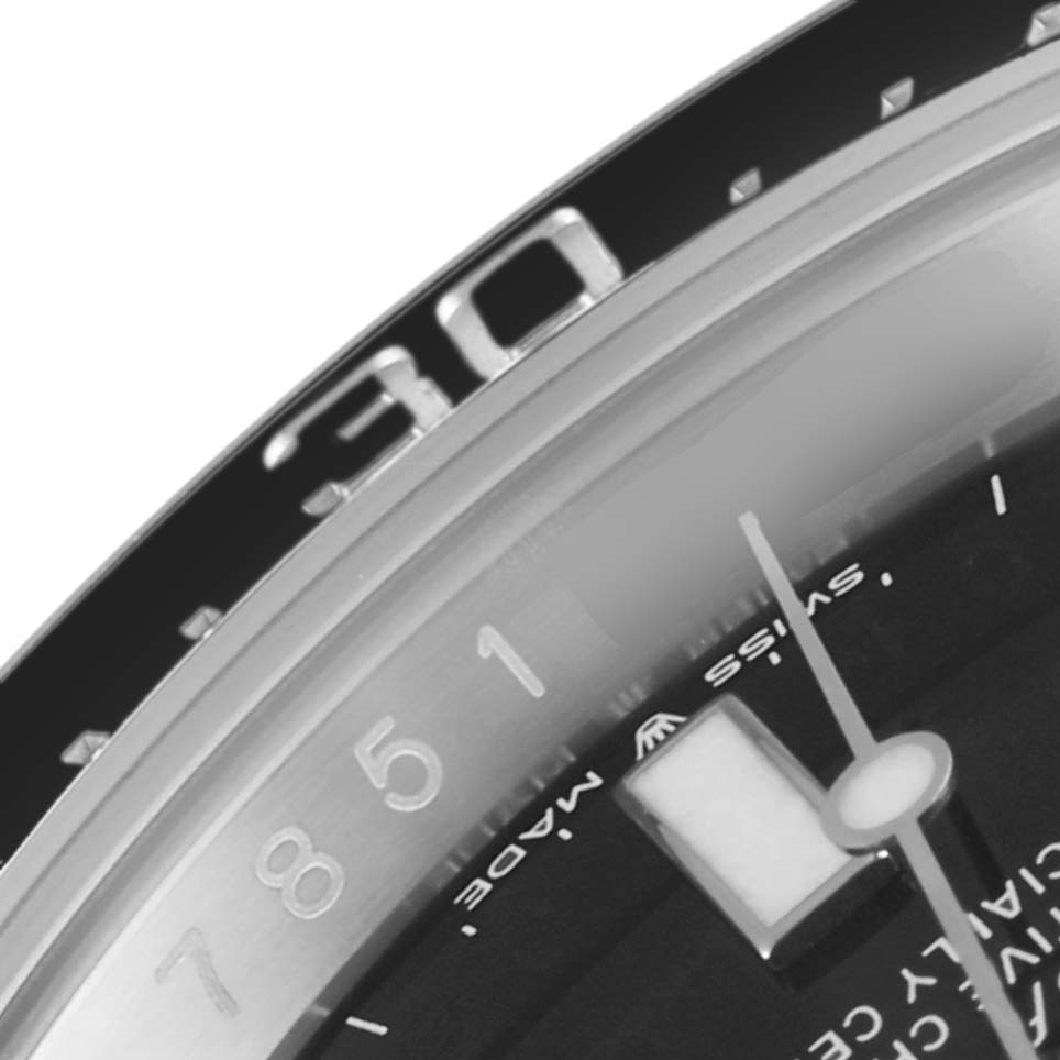 The image shows a close-up of the dial and bezel of a Rolex Sea-Dweller 126600 Men's Stainless Steel Black Dial 126600 Men's Stainless Steel Black Dial watch, highlighting numerals and part of the minute hand.