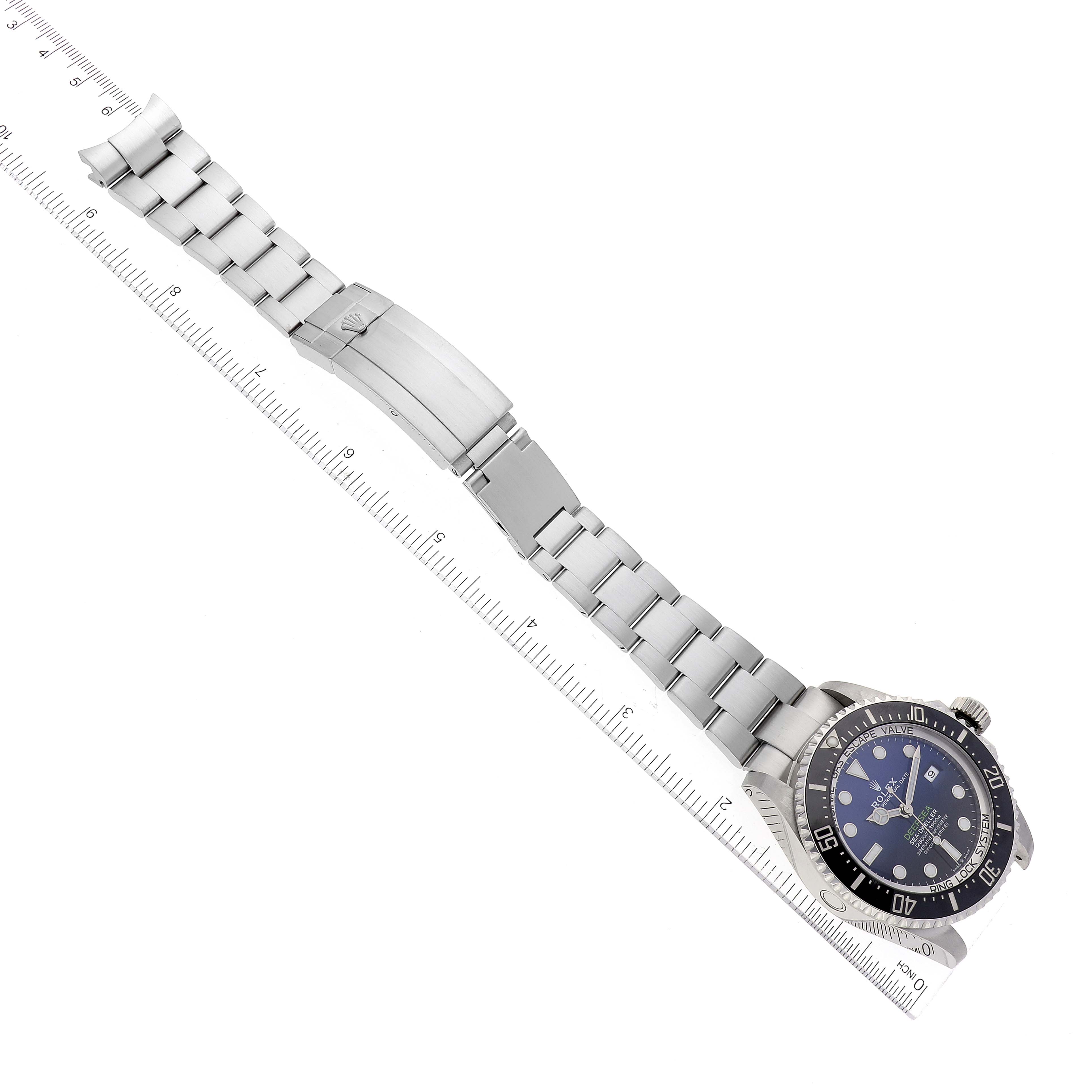 The image shows a top-down view of a Rolex Sea-Dweller 126660 Men
s Stainless Steel Blue Dial 126660 Men
s Stainless Steel Blue Dial watch, displaying the watch face, bezel, and metal bracelet with a clasp.