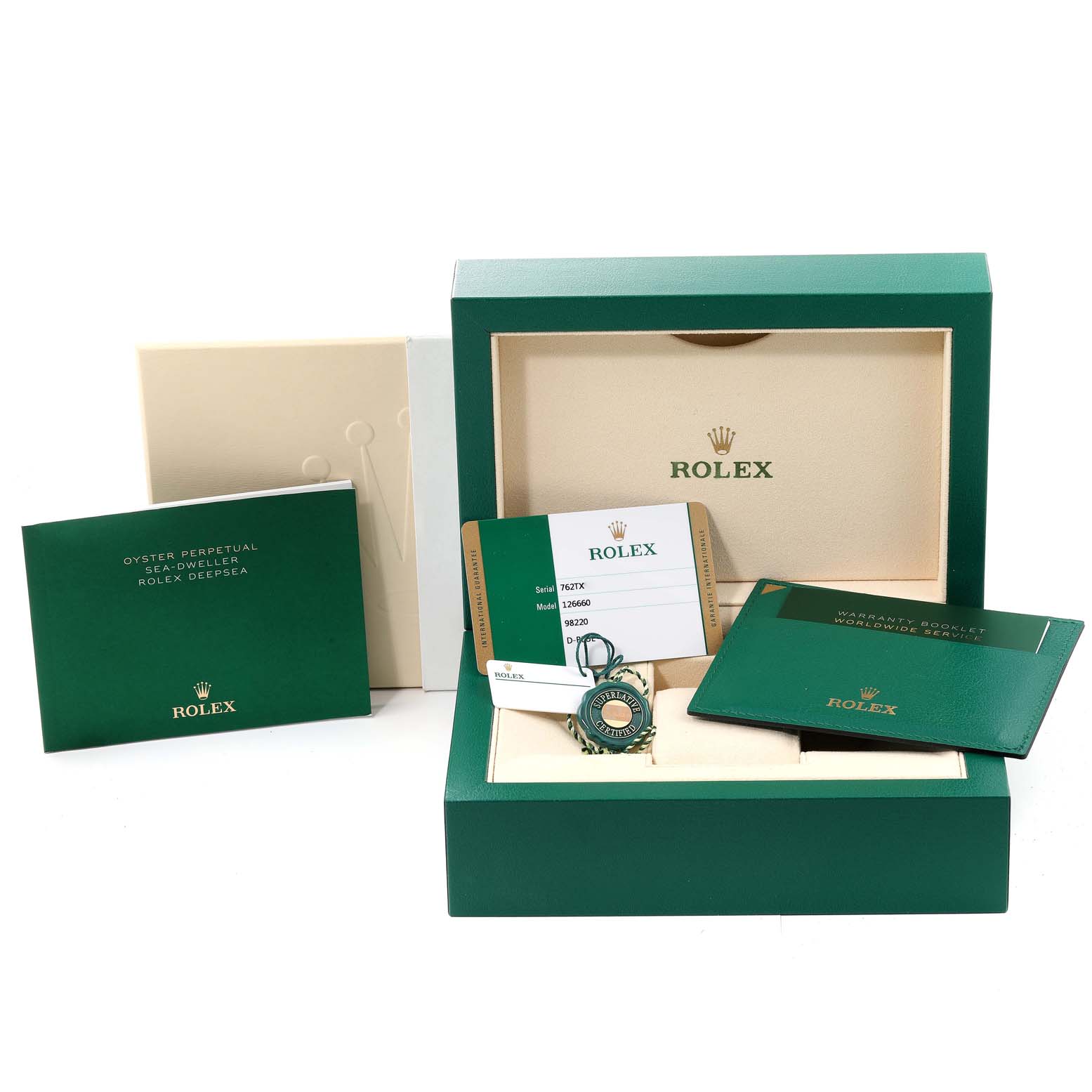 The image shows the packaging and accessories of the Rolex Sea-Dweller 126660 Men
s Stainless Steel Blue Dial 126660 Men
s Stainless Steel Blue Dial, including a green box, warranty card, manual, and tags.