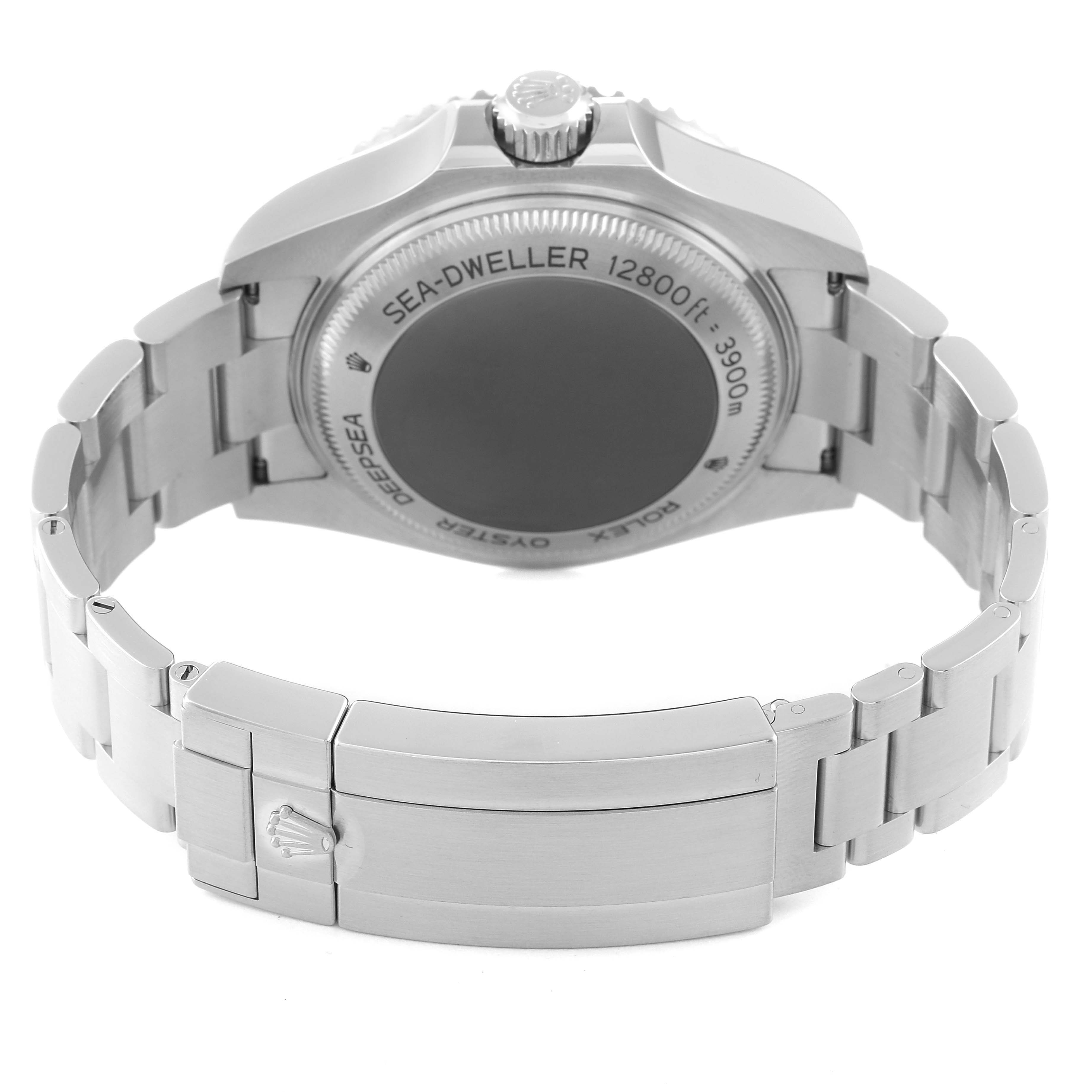 The image shows the back case and bracelet clasp of a Rolex Sea-Dweller 126660 Men
s Stainless Steel Blue Dial 126660 Men
s Stainless Steel Blue Dial watch, angled upwards for a clear view of the engravings.