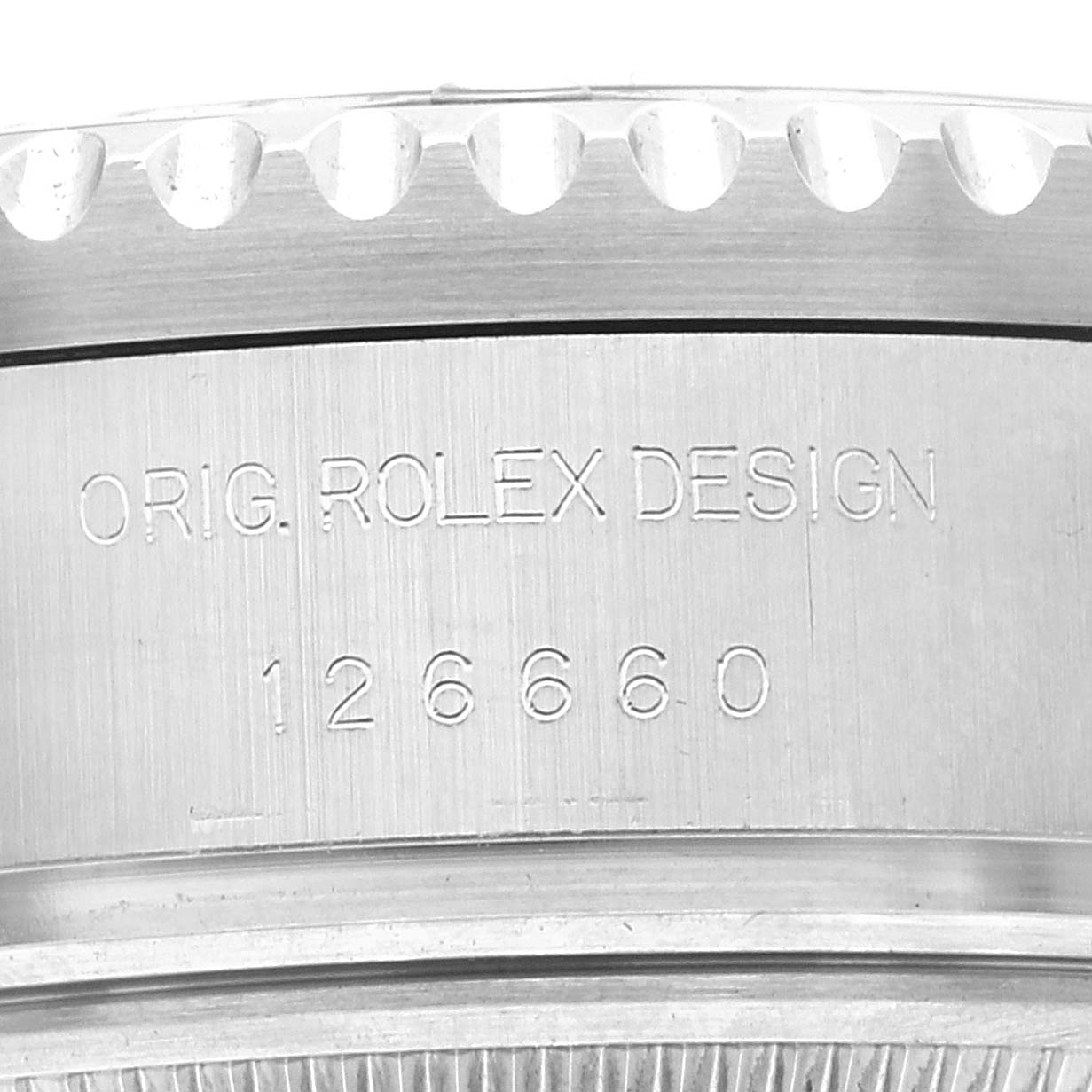 This close-up image shows the side of a Rolex Sea-Dweller 126660 Men
s Stainless Steel Blue Dial 126660 Men
s Stainless Steel Blue Dial watch, focusing on the model number and "Orig. Rolex Design" engraving.