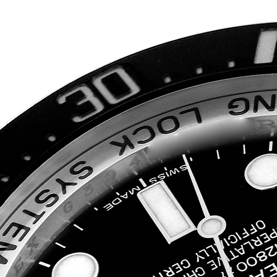 This close-up image shows the bezel and part of the dial of the Rolex Sea-Dweller 116660 Men
s Stainless Steel Black Dial 116660 Men
s Stainless Steel Black Dial watch.
