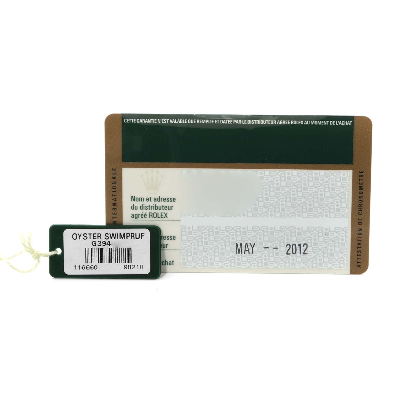 This image shows the warranty card and a tag for the Rolex Sea-Dweller 116660 Men
s Stainless Steel Black Dial 116660 Men
s Stainless Steel Black Dial model, dated May 2012.