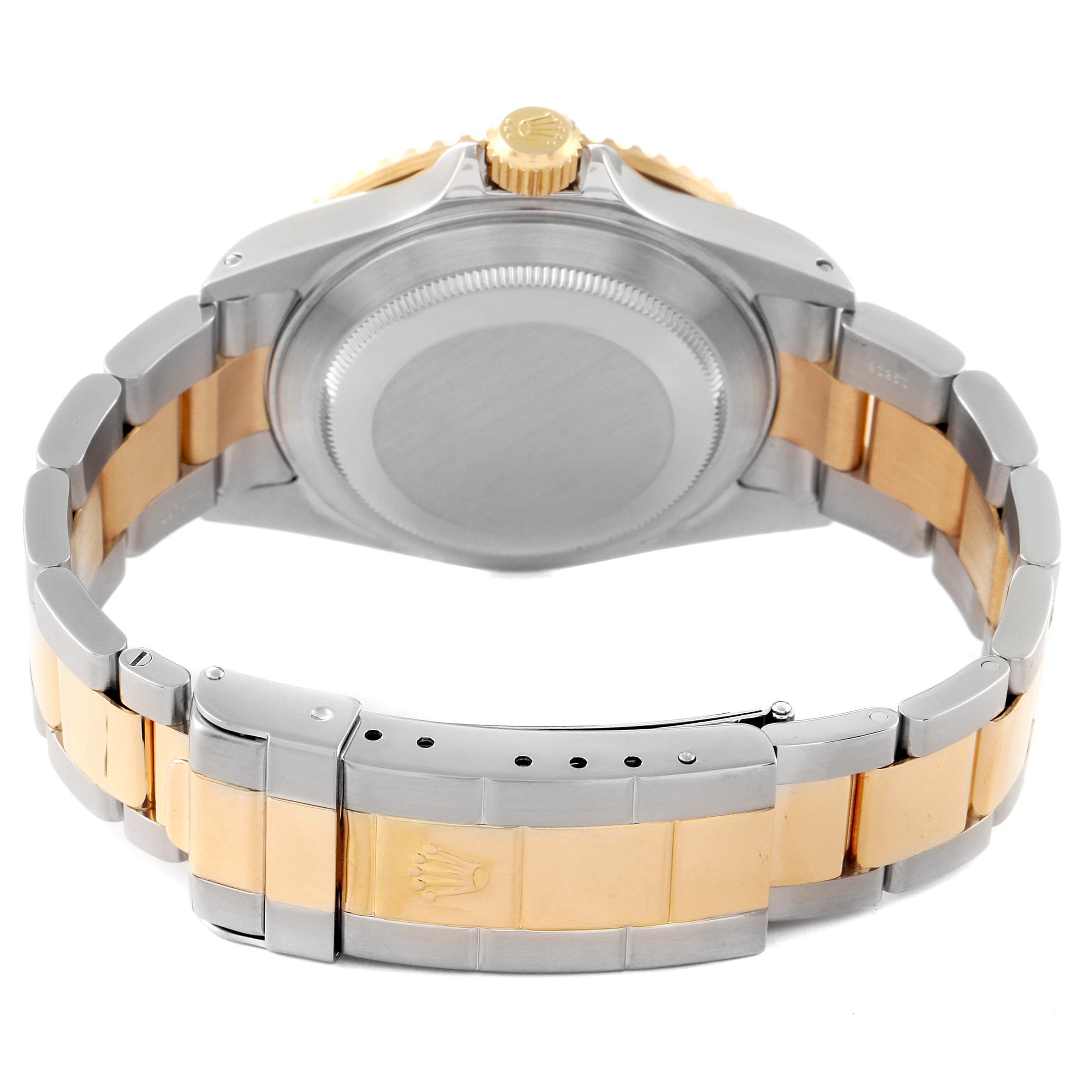 The image shows the back and bracelet of a Rolex Submariner 16613 Men
s Steel and Gold (two tone) Blue Dial 16613 Men
s Steel and Gold (two tone) Blue Dial watch at an angled rear view.