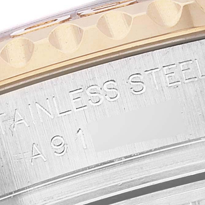 This close-up image showcases the side engraving and part of the bezel of the Rolex Yacht-Master 169623 Women's Steel and Gold (two tone) White Dial 169623 Women's Steel and Gold (two tone) White Dial watch.