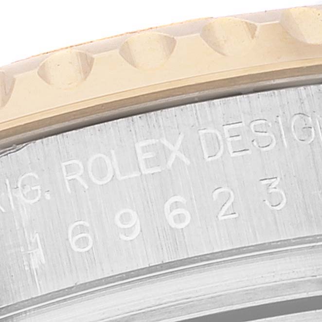 The image shows a close-up of the bezel and casing side with engraved text of a Rolex Yacht-Master 169623 Women's Steel and Gold (two tone) White Dial 169623 Women's Steel and Gold (two tone) White Dial watch.